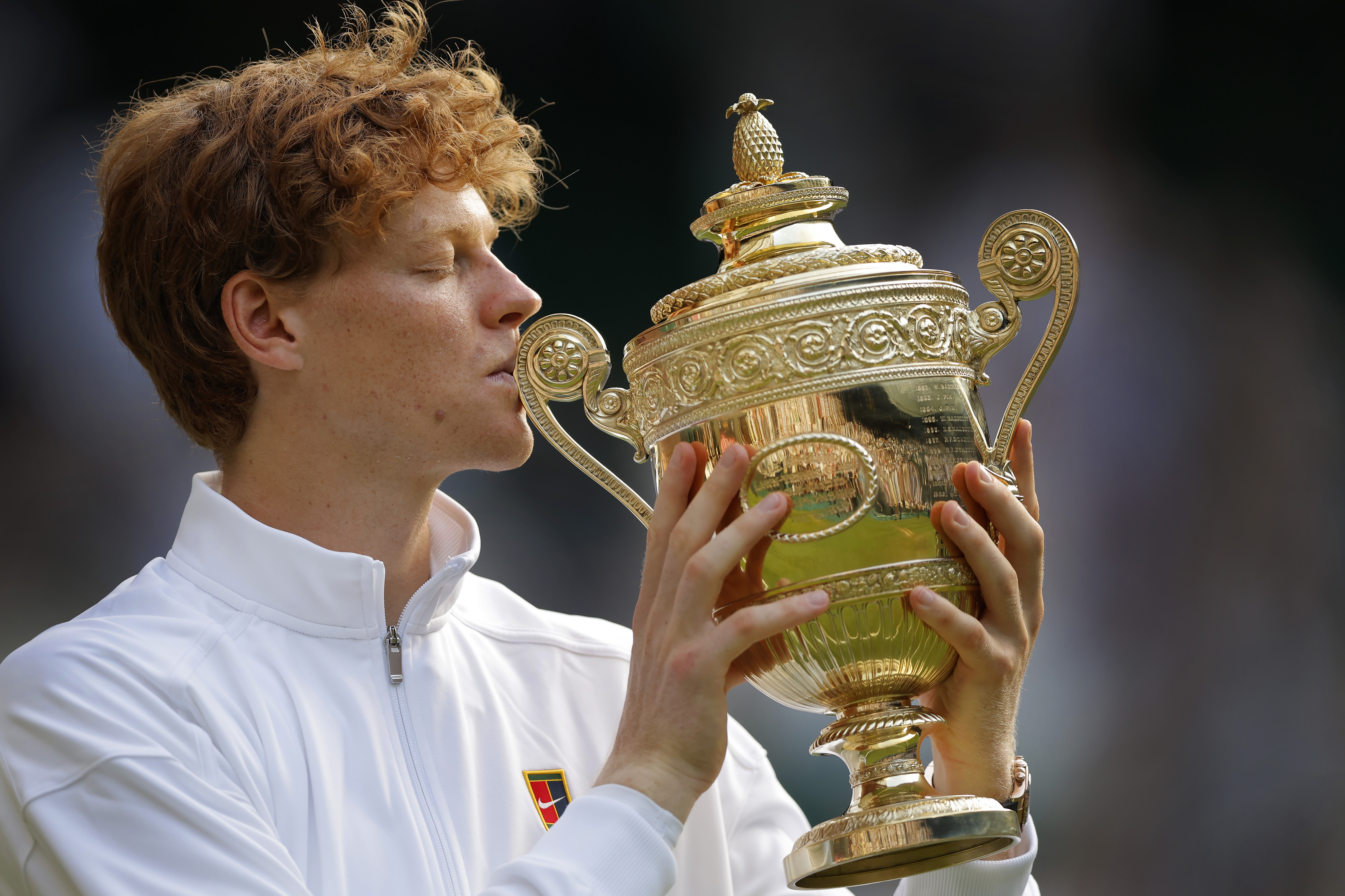 Jannik Sinner kisses the trophy after victory in the men's singles final on Centre Court during day fourteen of the 2025 Wimbledon Tennis Championships at the All England Club Lawn Tennis and Croquet Club on July 13th 2025 in London, England (Photo by Tom Jenkins/ Getty Images)