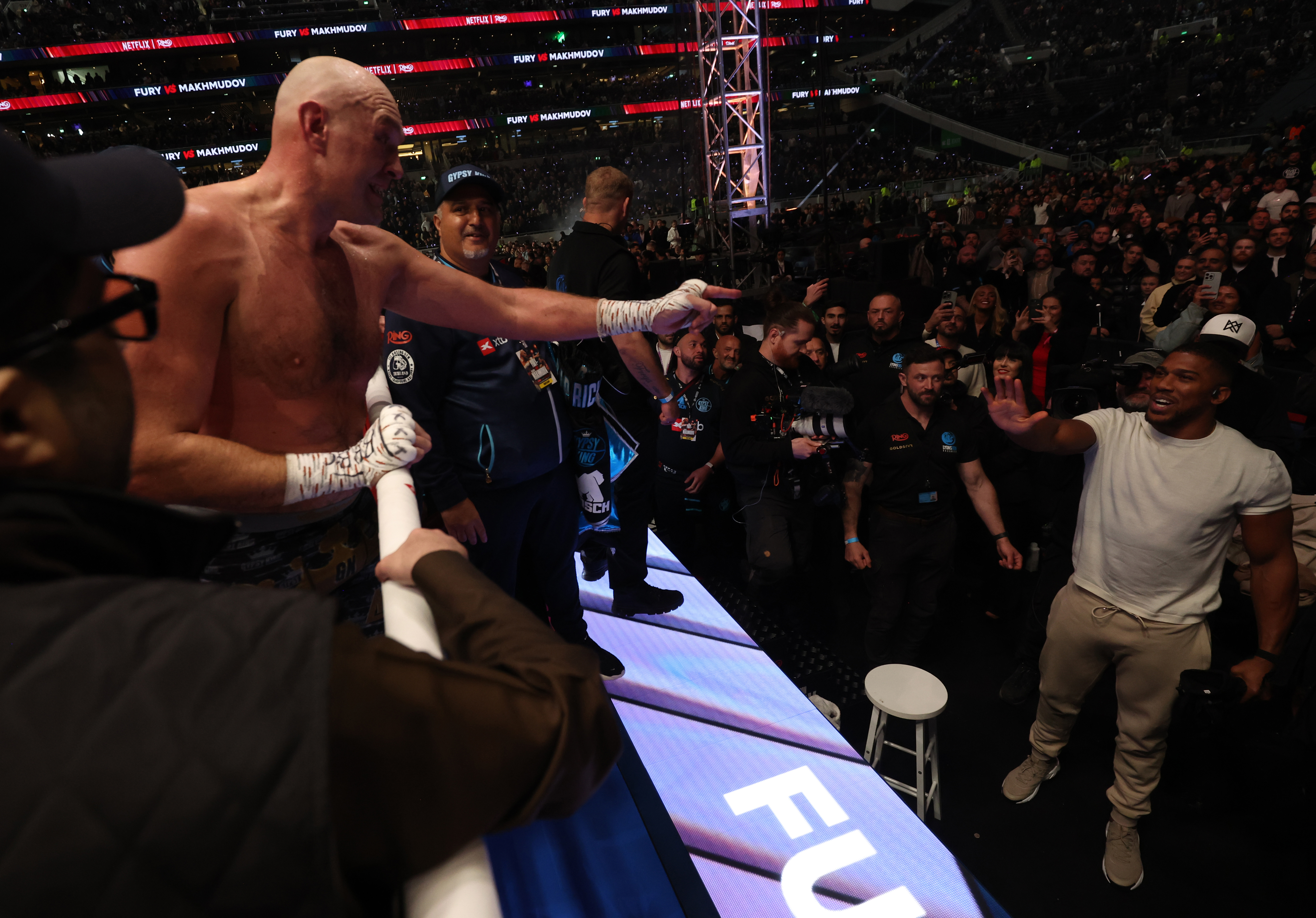 LONDON, ENGLAND - APRIL 11: Tyson Fury (L) calls out Anthony Joshua (white shirt) to fight him next after he wins his Heavyweight Contest against Arslanbek Makhmudov at Tottenham Hotspur Stadium on April 11, 2026 in London, England. (Photo by Mark Robinson/Getty Images)