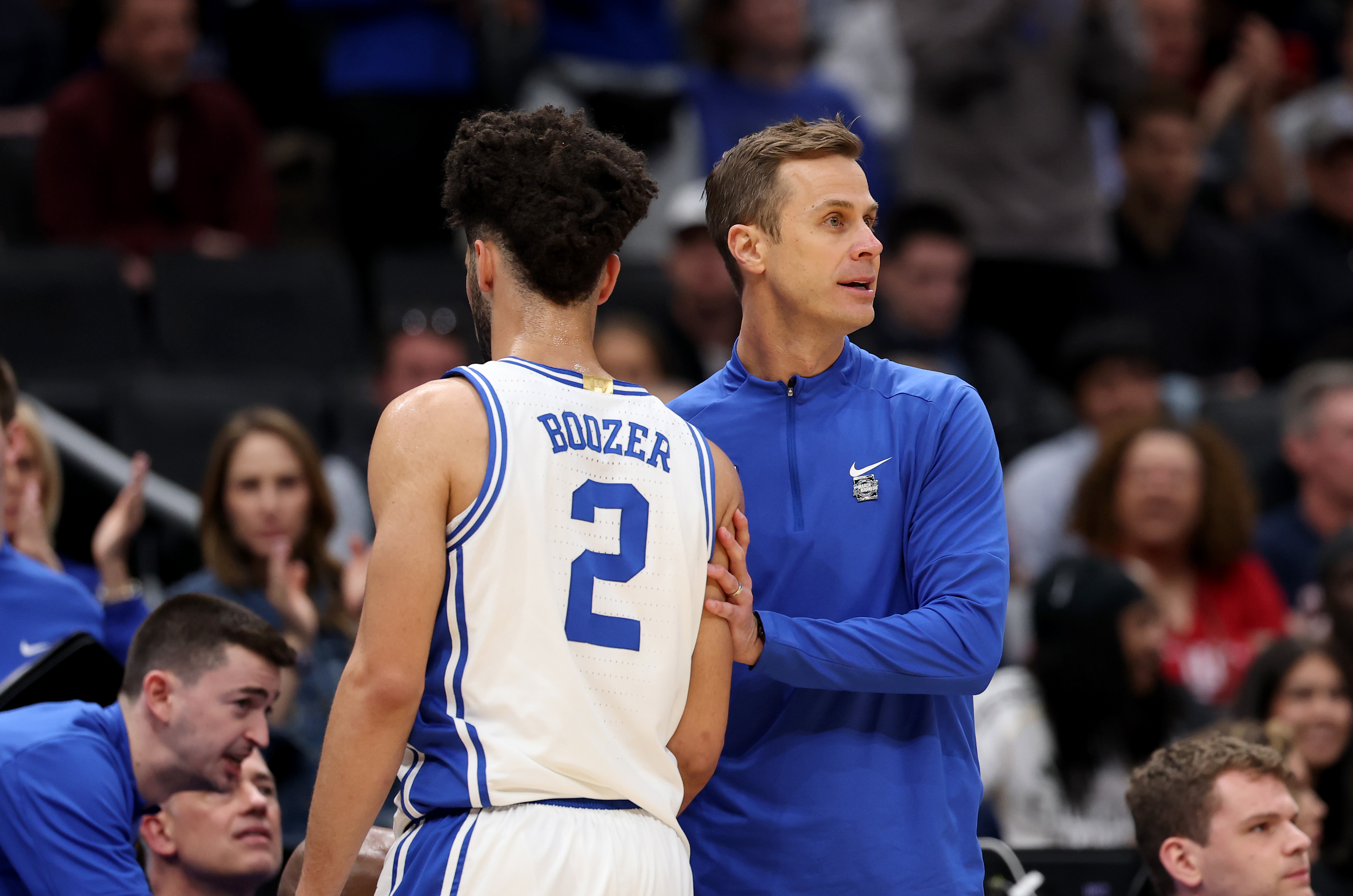 WASHINGTON, DC - MARCH 29: Head coach Jon Scheyer of the Duke Blue Devils talks with Cayden Boozer #2 in the first half against the UConn Huskies during the Elite Eight round game of the 2026 NCAA Men's Basketball Tournament held at Capital One Arena on March 29, 2026 in Washington, DC.  (Photo by Scott Taetsch/NCAA Photos via Getty Images)