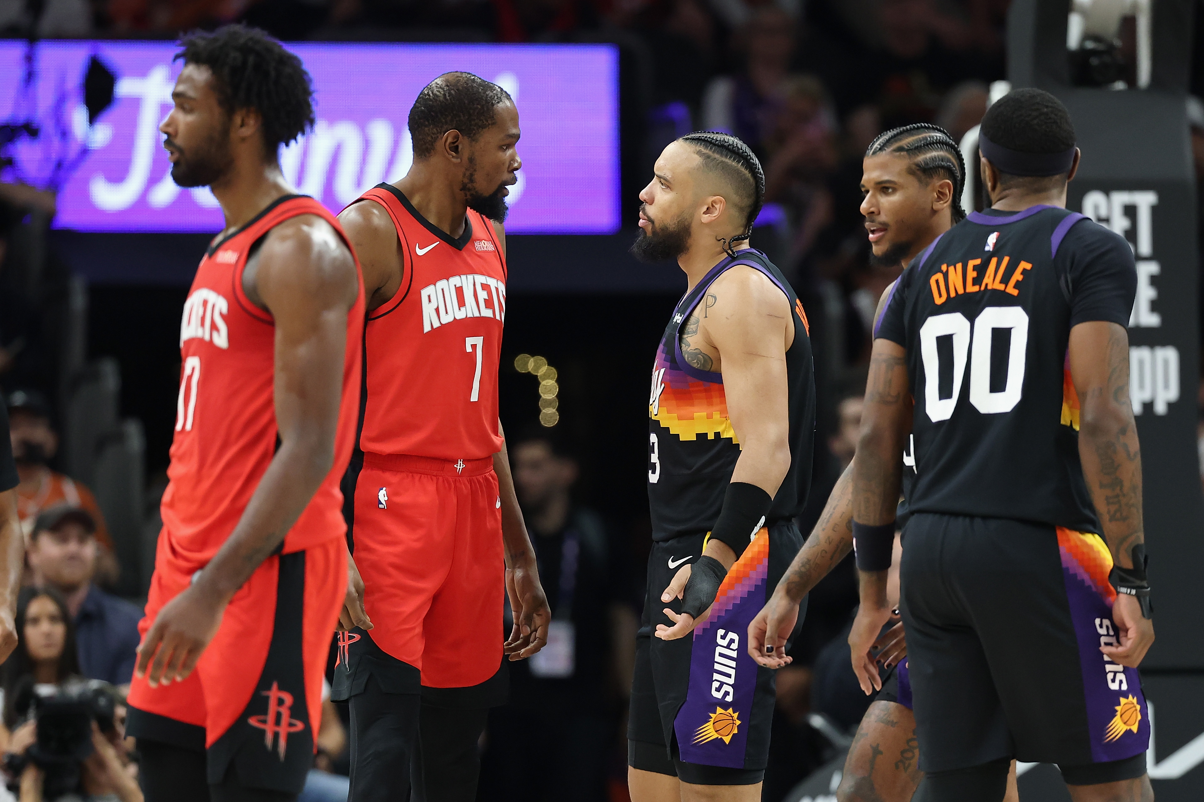  Kevin Durant #7 of the Houston Rockets and Dillon Brooks #3 of the Phoenix Suns react during the first half of the NBA game at Mortgage Matchup Center on April 07, 2026 in Phoenix, Arizona.  NOTE TO USER: User expressly acknowledges and agrees that, by downloading and or using this photograph, user is consenting to the terms and conditions of the Getty Images License Agreement.  (Photo by Christian Petersen/Getty Images)