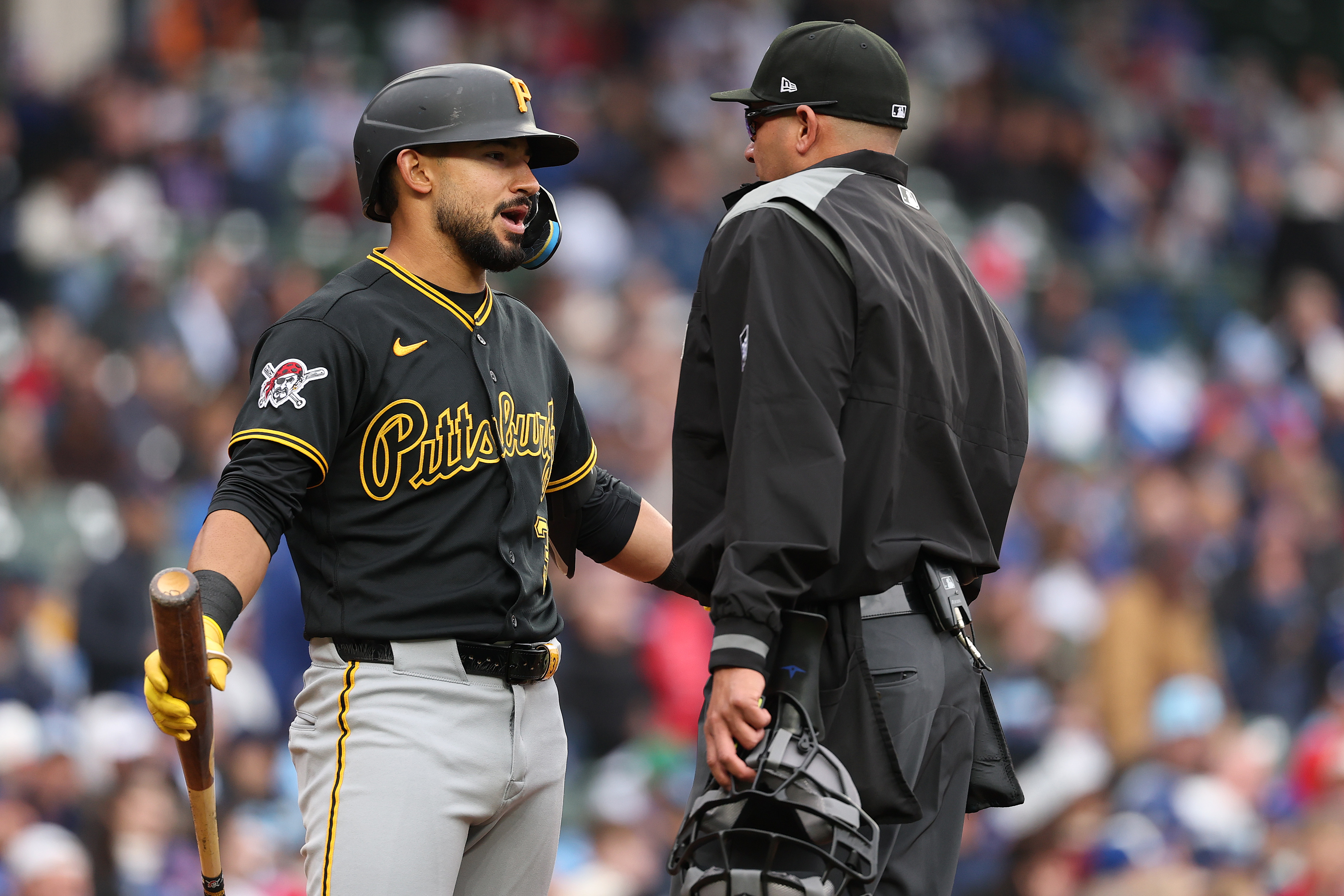 CHICAGO, ILLINOIS - APRIL 10: Nick Gonzales #3 of the Pittsburgh Pirates argues with home plate umpire Roberto Ortiz #40 against the Chicago Cubs at Wrigley Field on April 10, 2026 in Chicago, Illinois. (Photo by Michael Reaves/Getty Images)