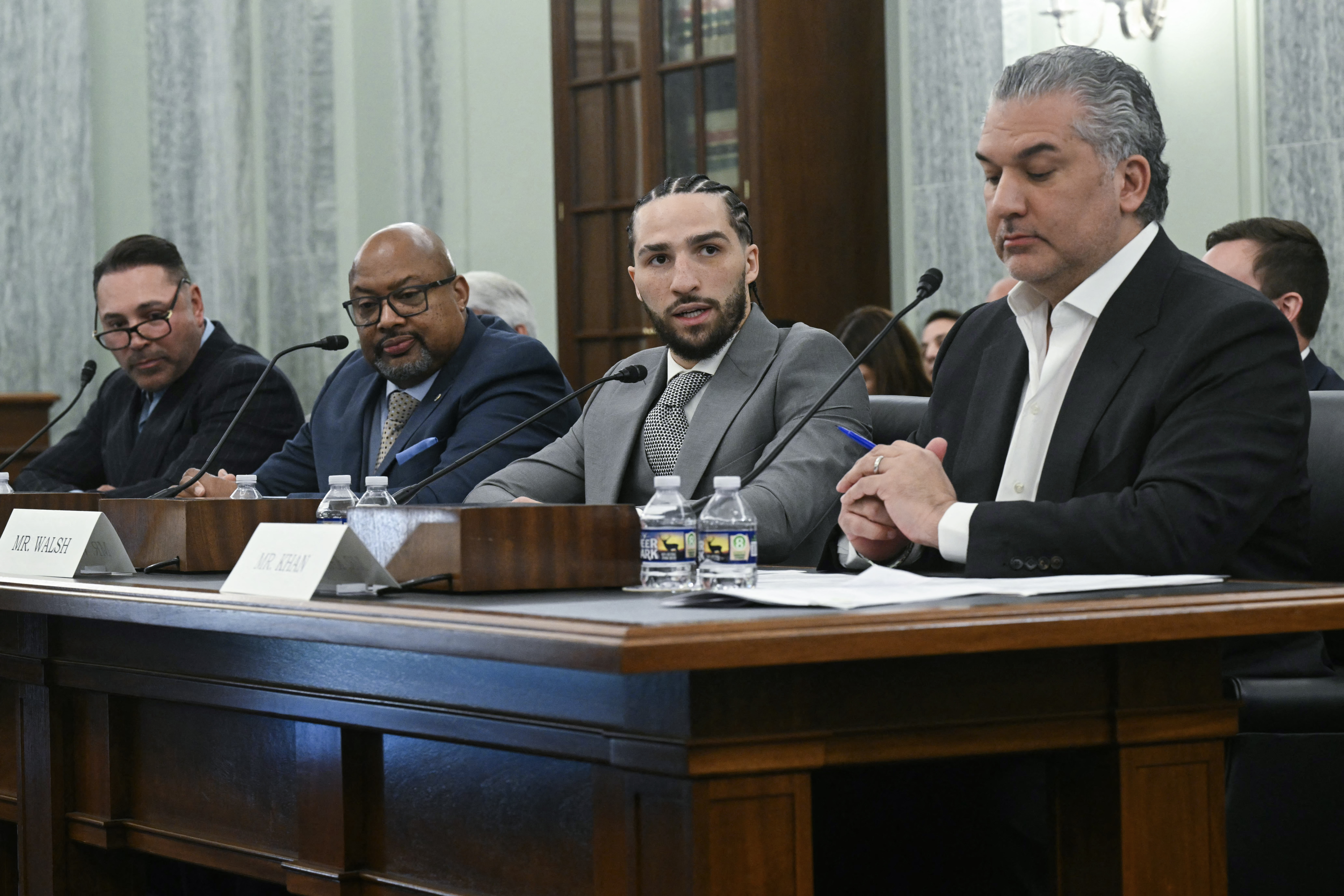 (L-R) Oscar De La Hoya, former professional boxer and CEO of Golden Boy Promotions, Timothy Shipman, President of the Association of Boxing Commissions and Combative Sports, US professional boxer Nico Ali Walsh and Nick Khan, President of World Wrestling Entertainment (WWE) testify during a Senate Committee on Commerce, Science, and Transportation hearing to "examine federal boxing laws" on Capitol Hill in Washington, DC, on April 22, 2026. (Photo by SAUL LOEB / AFP via Getty Images)