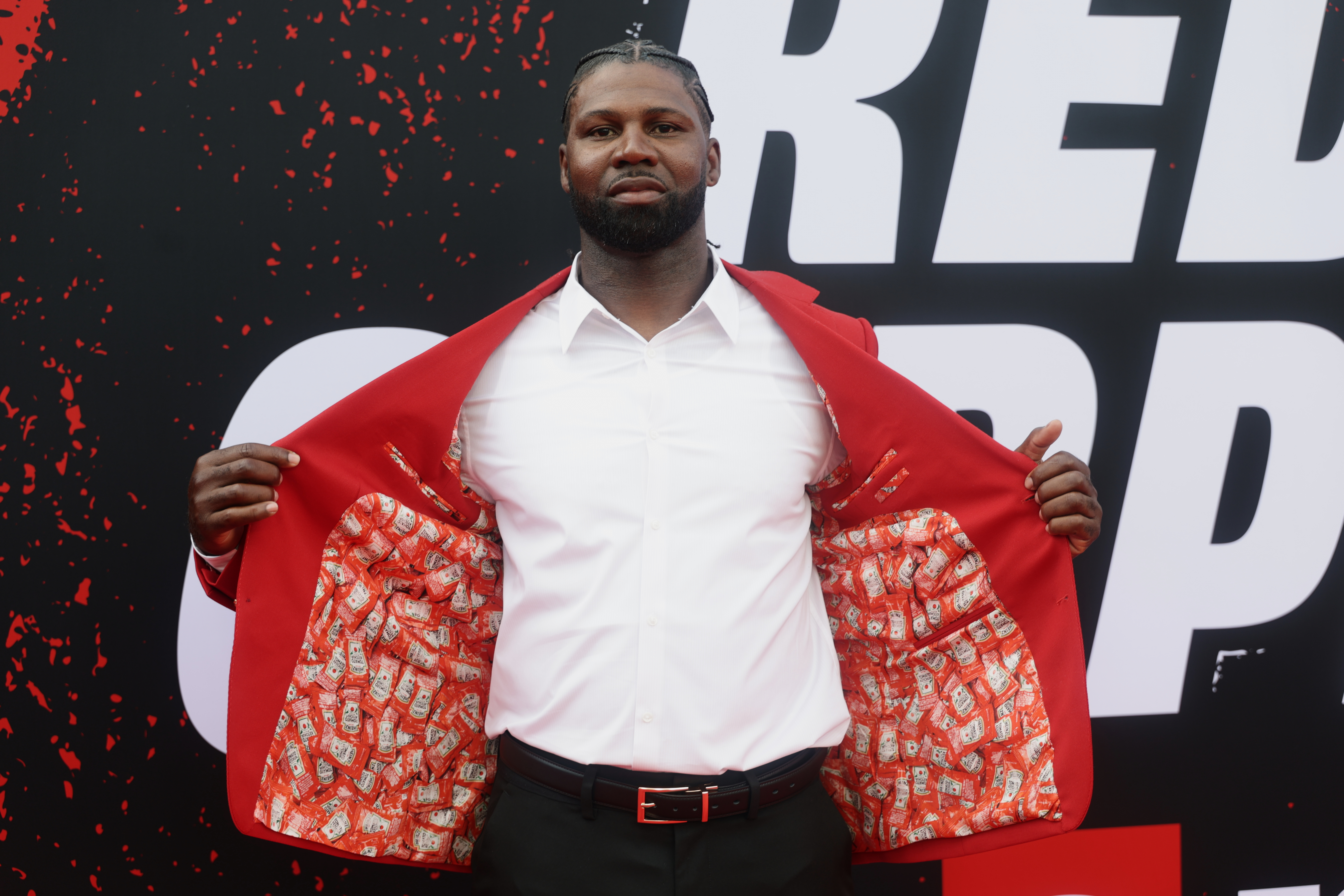 IMAGE DISTRIBUTED FOR KRAFT HEINZ - NFL legend Deven Hester debuts the first-ever "Mr. 57" jacket with HEINZ, celebrating the 57th pick of the NFL Draft on Thursday, April 23, 2026 in Pittsburgh. (Adam Hunger/AP Content Services for Kraft Heinz)
