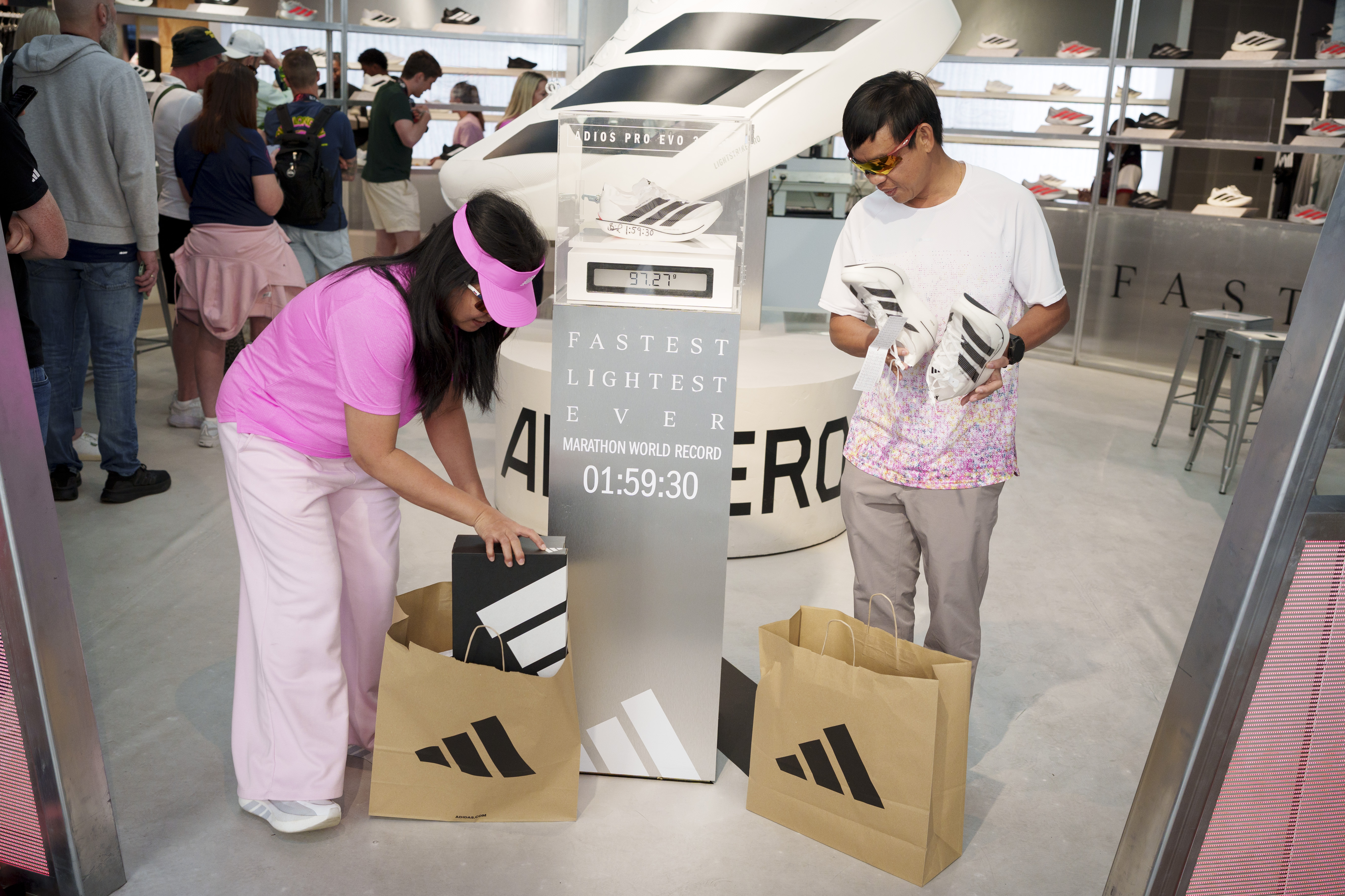 The morning after Kenyan runner Sabastian Sawe won the London Marathon with a world record time of 1:59.30, the first-ever sub-two-hour marathon in a competitive race, shoppers who have bought the same Adidas Adizero Adios Pro Evo 3 running shoes as Sawe's, one of which is autographed at the Adidas store in London's Oxford Street, on 27th April 2026, in London, England. Sawe was the first to beat the iconic 2hr barrier but in second place, and also under two hours, came the Ethiopian Yomif Kejelcha in his forst ever marathon. Both wore the Adidas Adizero Adios Pro Evo 3 which weighs a little over 97 grams and retails for £450. (Photo by Richard Baker / In Pictures via Getty Images)