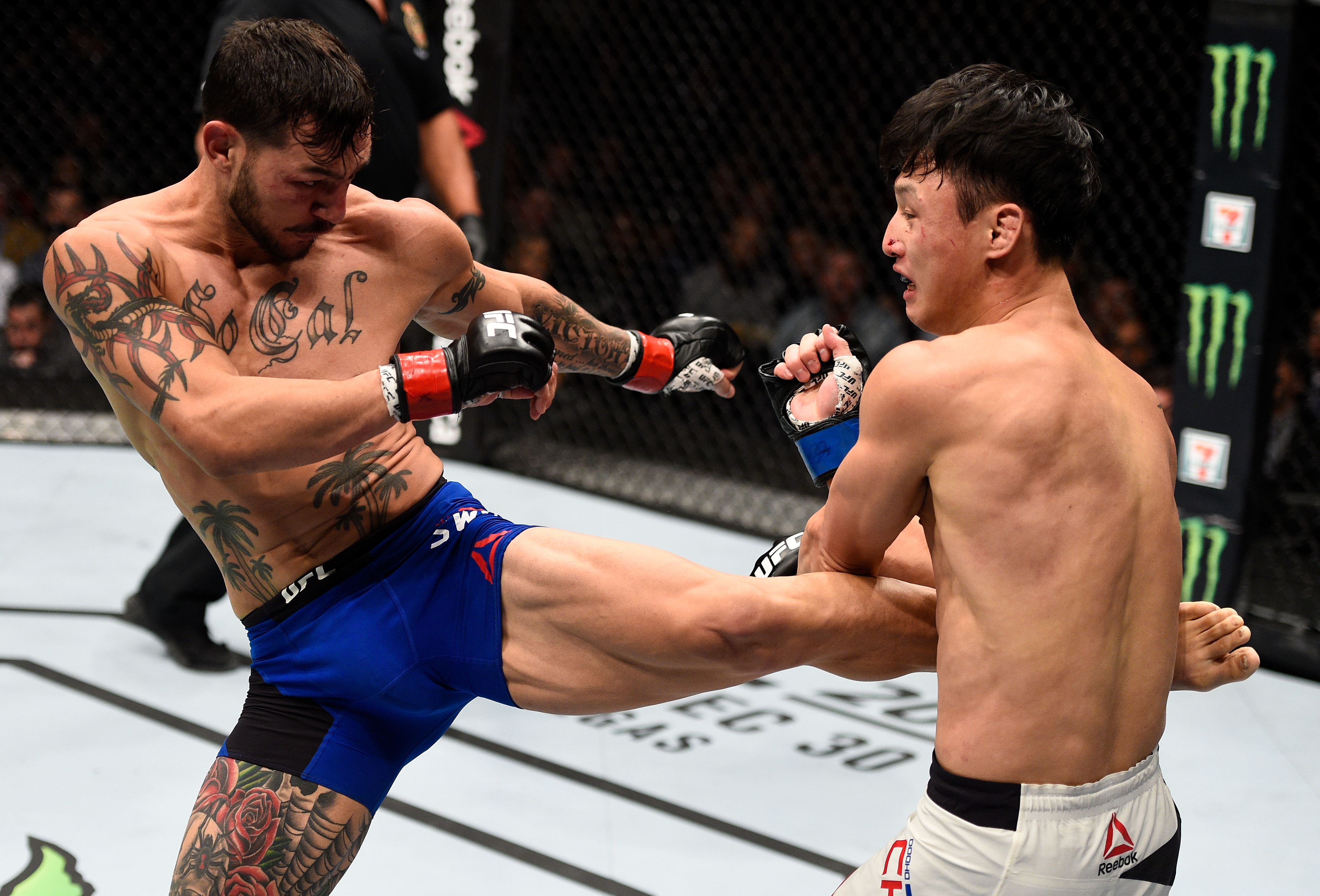 TORONTO, CANADA - DECEMBER 10:  (L-R) Cub Swanson kicks Dooho Choi of South Korea in their featherweight bout during the UFC 206 event inside the Air Canada Centre on December 10, 2016 in Toronto, Ontario, Canada. (Photo by Jeff Bottari/Zuffa LLC/Zuffa LLC via Getty Images)