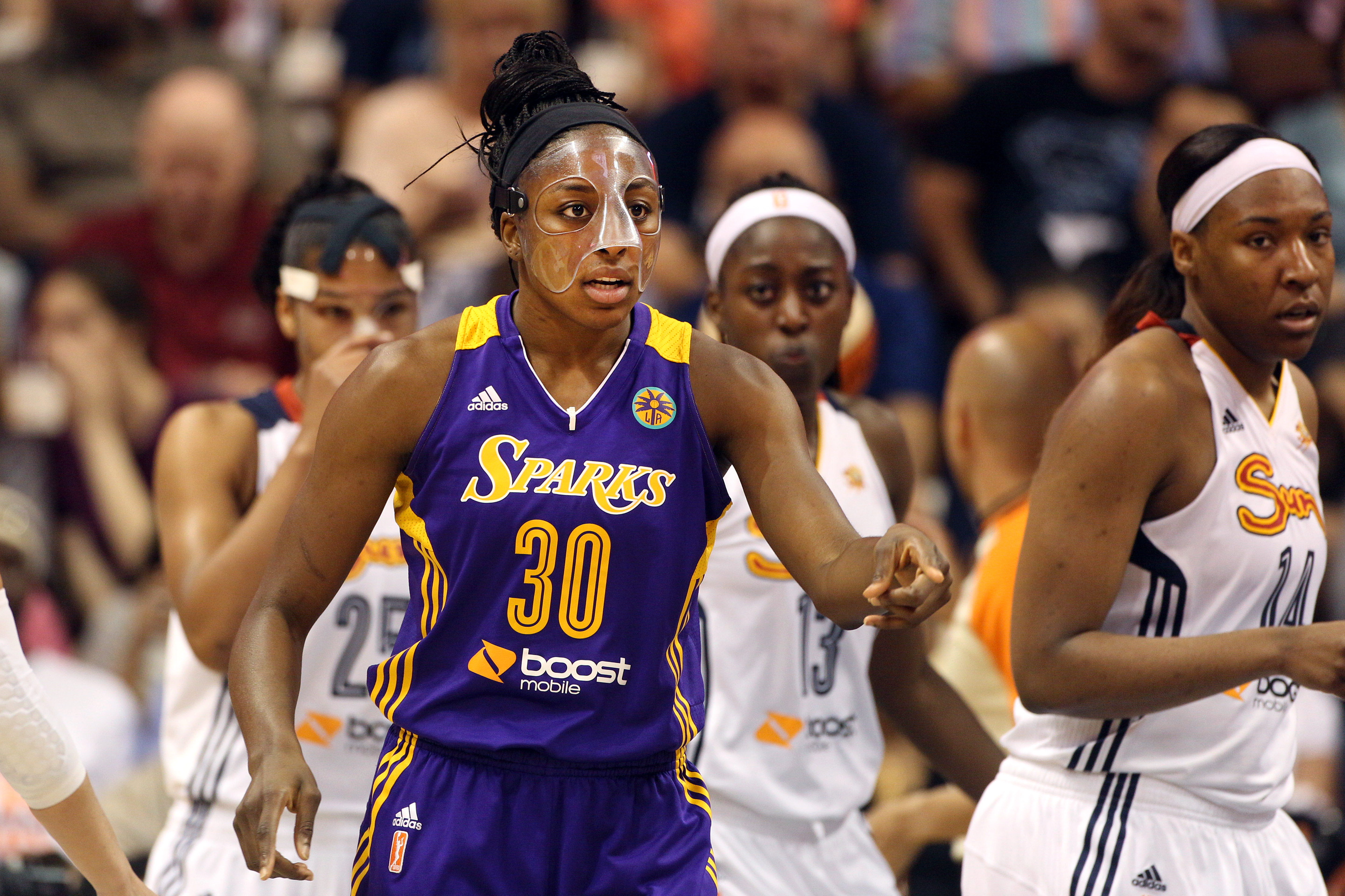 Nneka Ogwumike, Los Angeles Sparks, (wearing face mask), in action during the Connecticut Sun Vs Los Angeles Sparks WNBA regular season game at Mohegan Sun Arena, Uncasville, Connecticut, USA. 3rd July 2014. Photo Tim Clayton (Photo by Tim Clayton/Corbis via Getty Images)