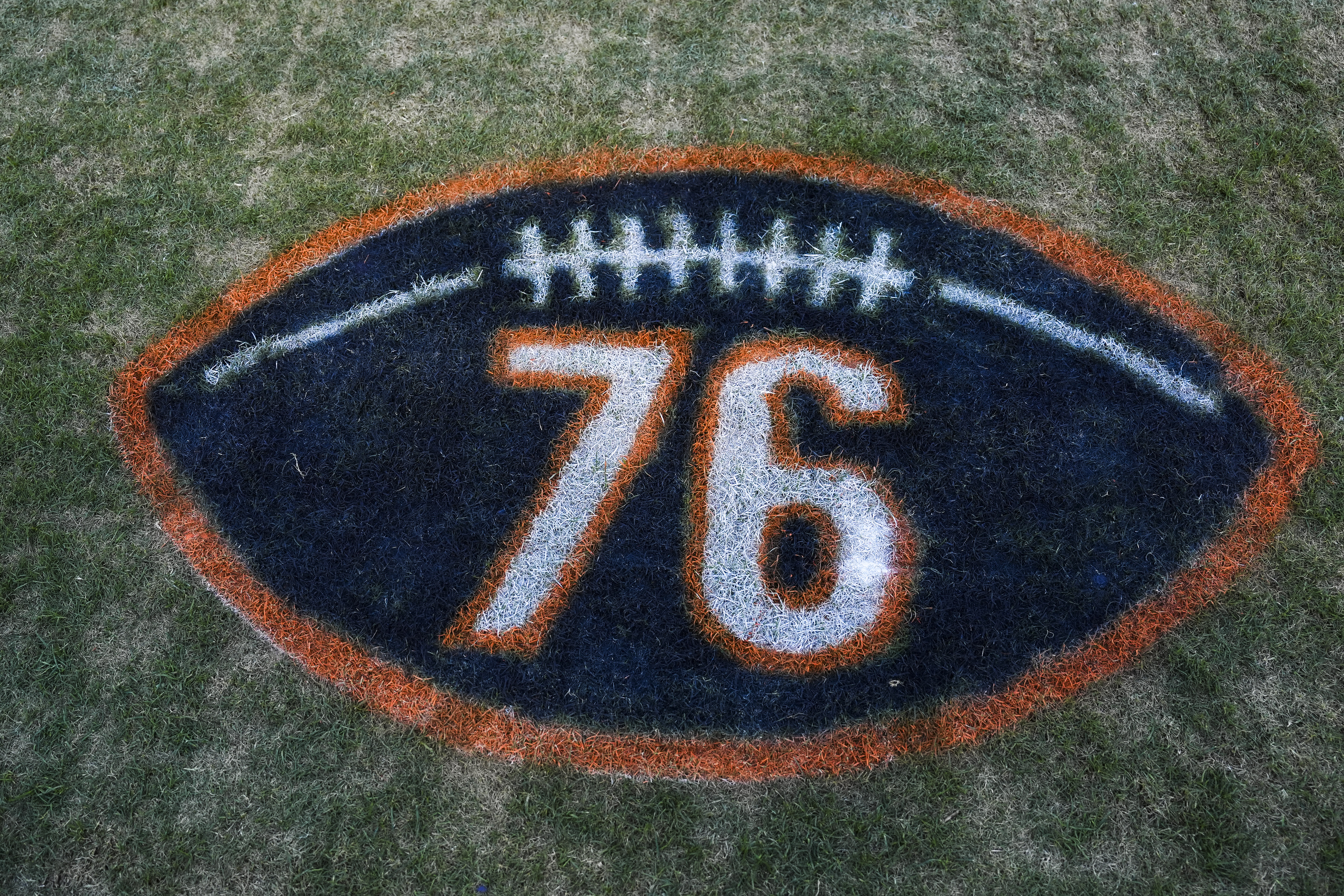 CHICAGO, ILLINOIS - SEPTEMBER 08:  Detail view of a 76 graphic honoring Steve McMichael prior to an NFL football game between the Minnesota Vikings and the Chicago Bears at Solider Field on September 8, 2025 in Chicago, Illinois . (Photo by Perry Knotts/Getty Images)