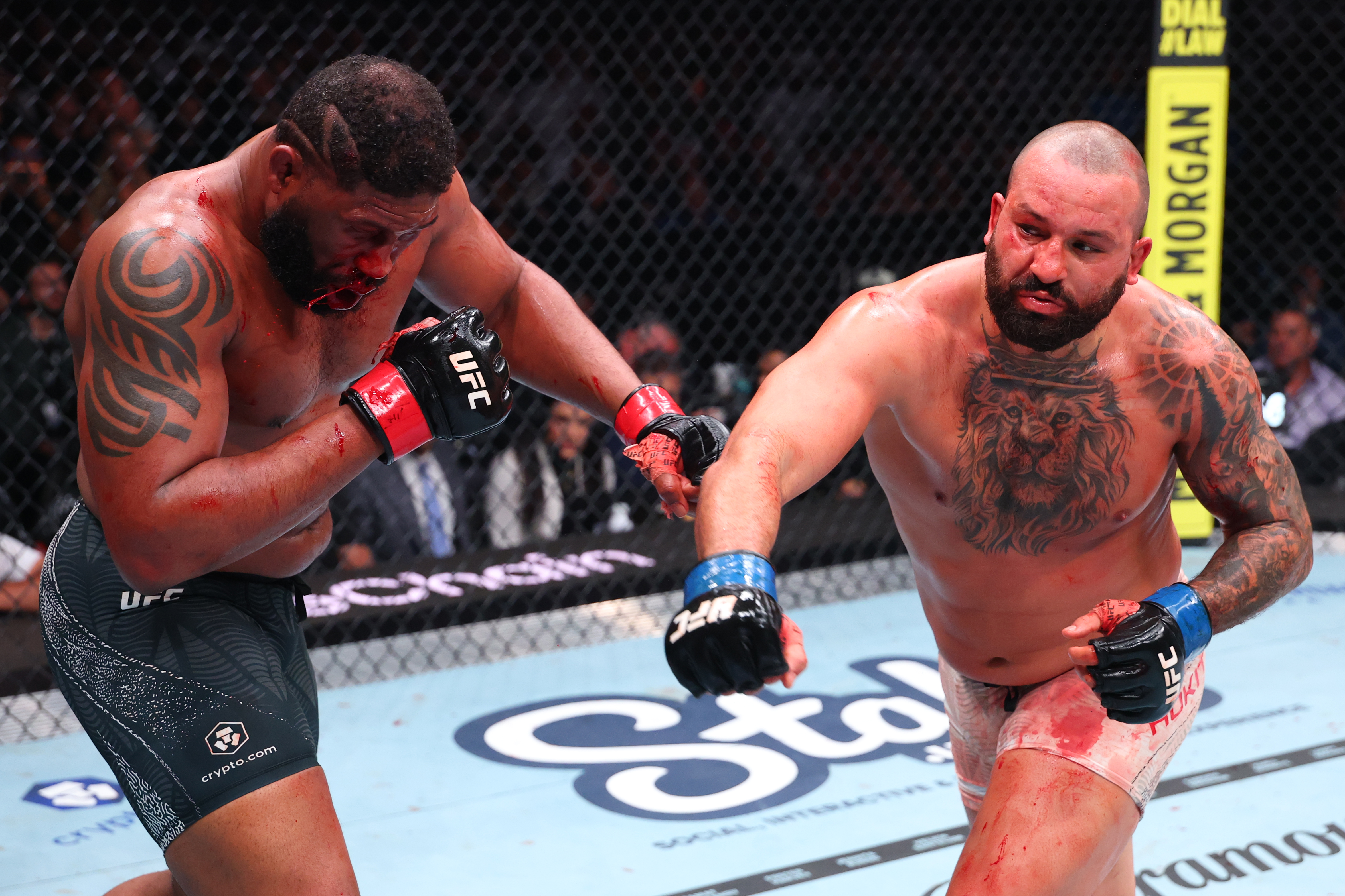 MIAMI, FLORIDA - APRIL 11: (R-L) Josh Hokit punches Curtis Blaydes in a heavyweight fight during the UFC 327 event at Kaseya Center on April 11, 2026 in Miami, Florida. (Photo by Ed Mulholland/Zuffa LLC)