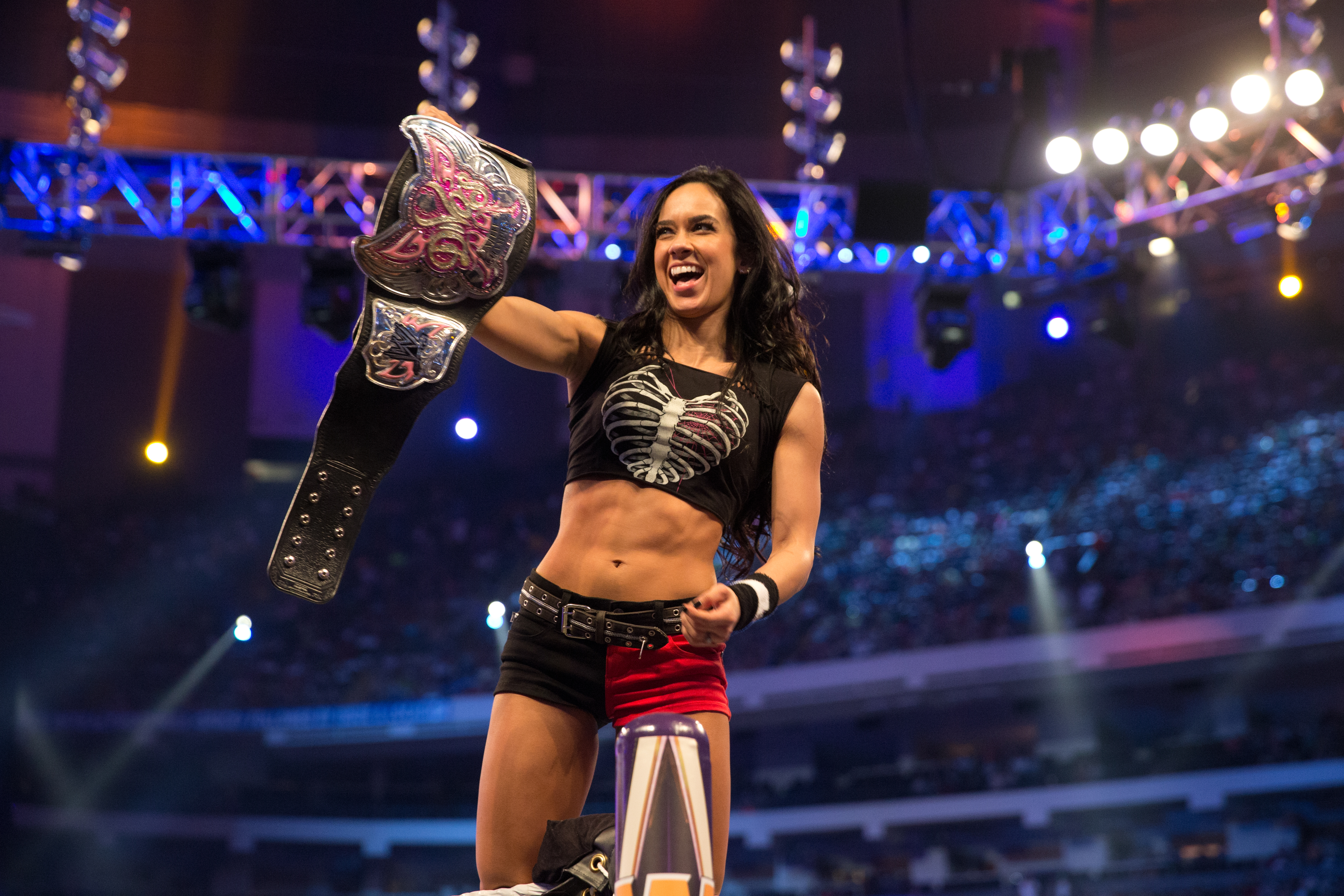 NEW ORLEANS, LOUISIANA - APRIL 4:  AJ Lee celebrates her win during WrestleMania 30 at the Mercedes-Benz Superdome on April 4, 2014 in New Orleans, Louisiana (Photo by John Giamundo/WWE via Getty Images)