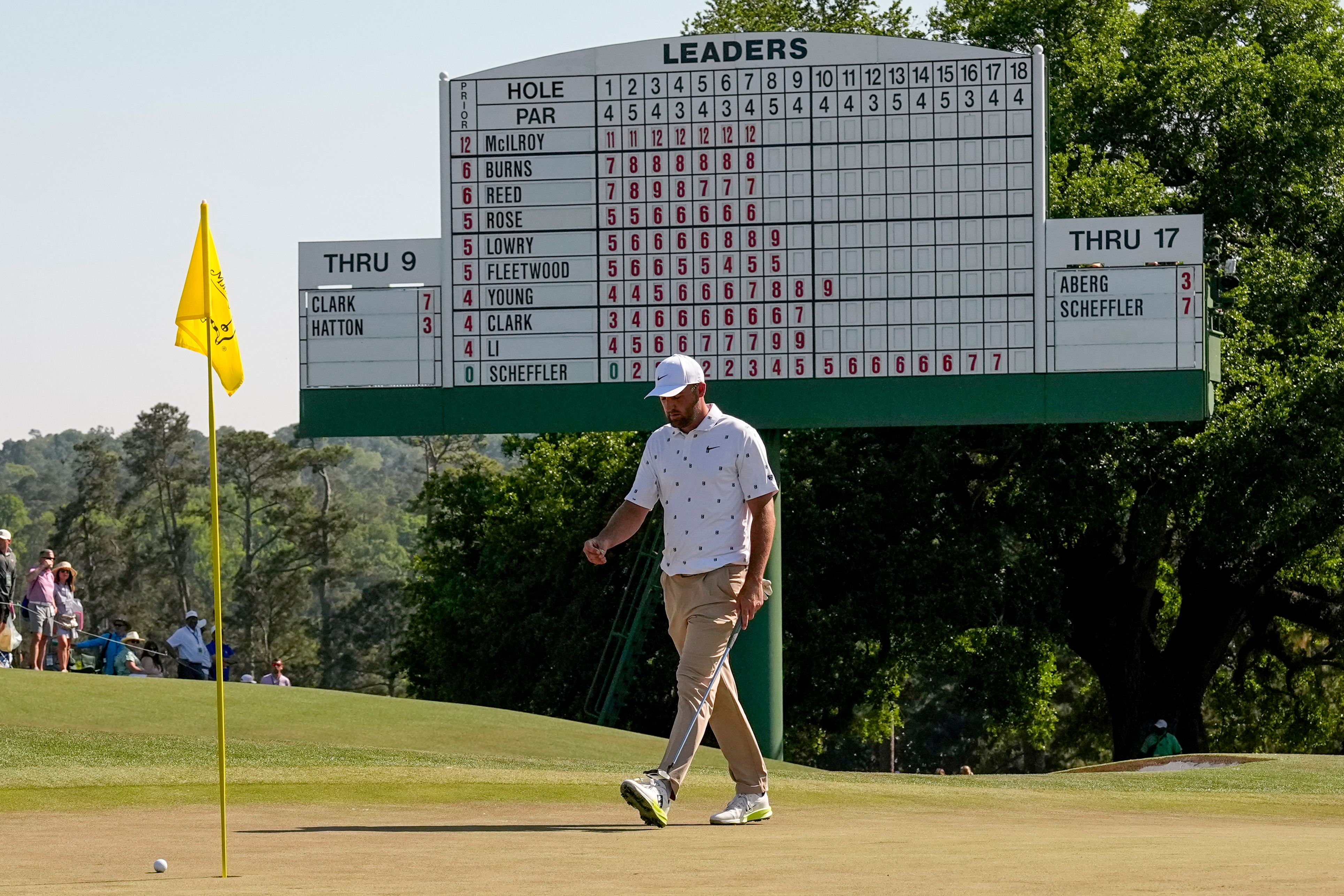 Scottie Scheffler walks to his ball on the 18th hole during the third round of the Masters golf tournament at the Augusta National Golf Club, Saturday, April 11, 2026, in Augusta, Ga. (AP Photo/David J. Phillip)