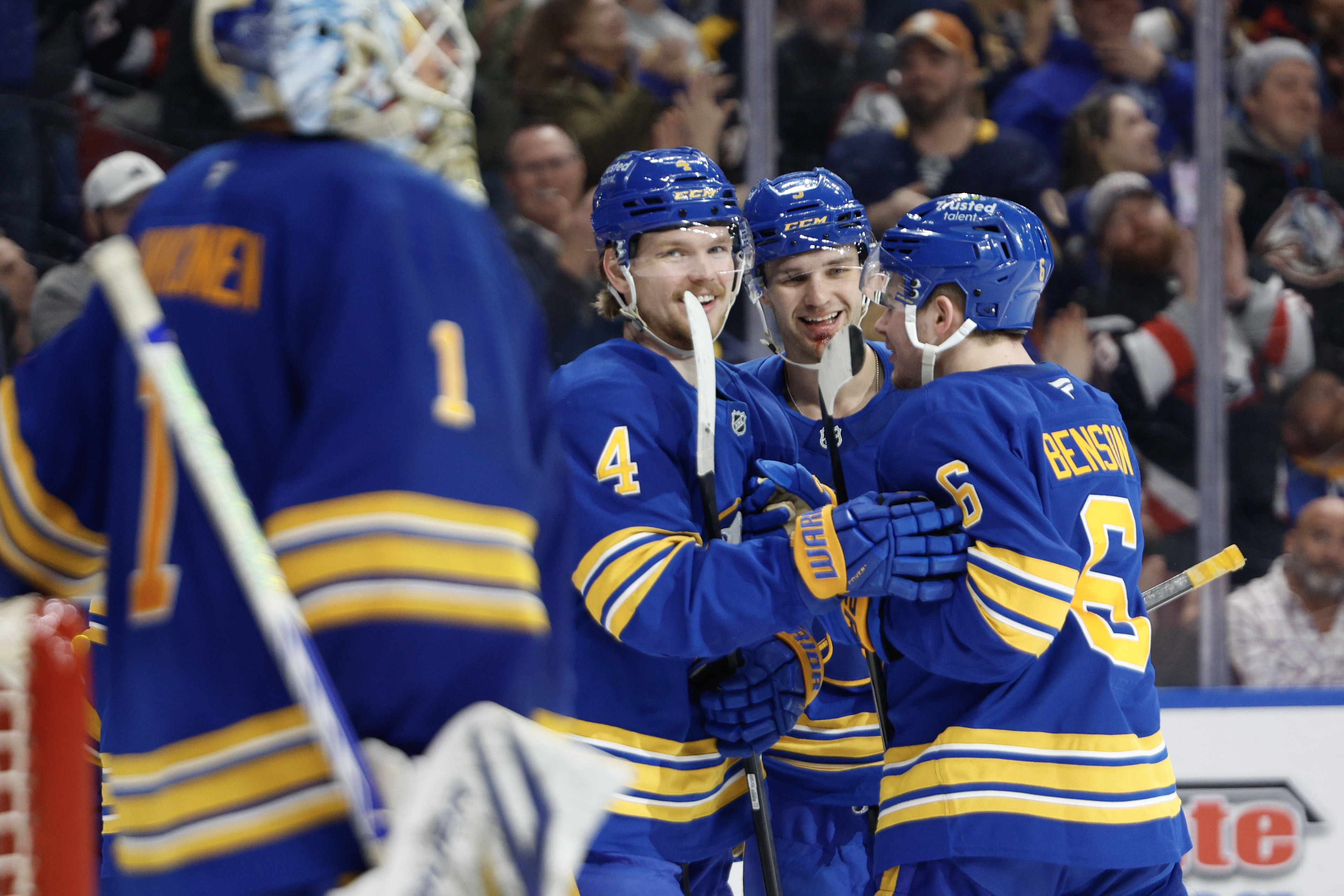 BUFFALO, NEW YORK - MARCH 31: Bowen Byram #4, Josh Norris #9 and Zach Benson #6 of the Buffalo Sabres celebrate a goal against the New York Islanders during the third period at KeyBank Center on March 31, 2026 in Buffalo, New York. (Photo by Rebecca Villagracia/Getty Images)