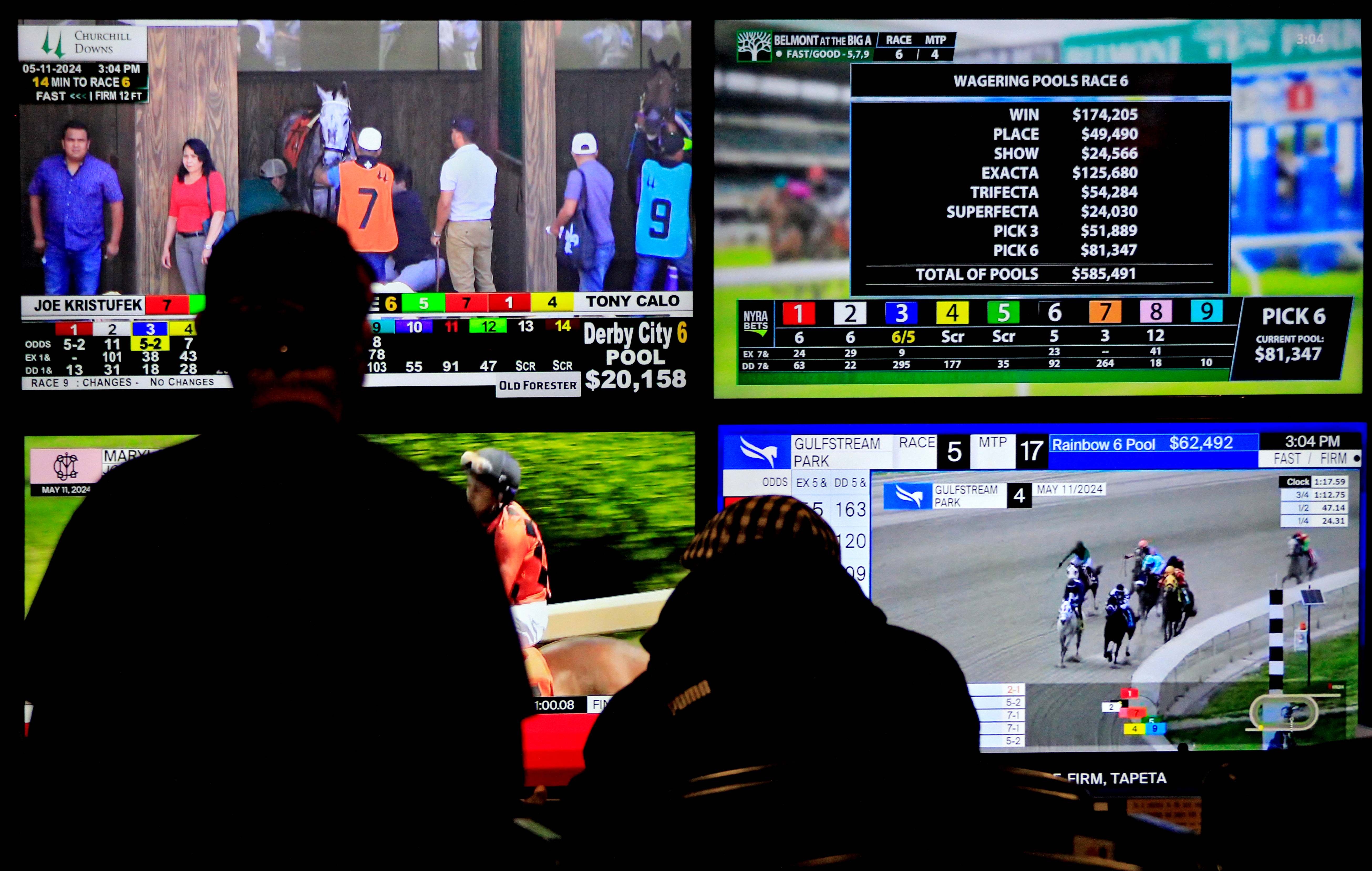 Bettors are watching televisions that are broadcasting live racing from racetracks across North America at Woodbine Racetrack in Toronto, Canada, on May 11, 2024. (Photo by Mike Campbell/NurPhoto via Getty Images)