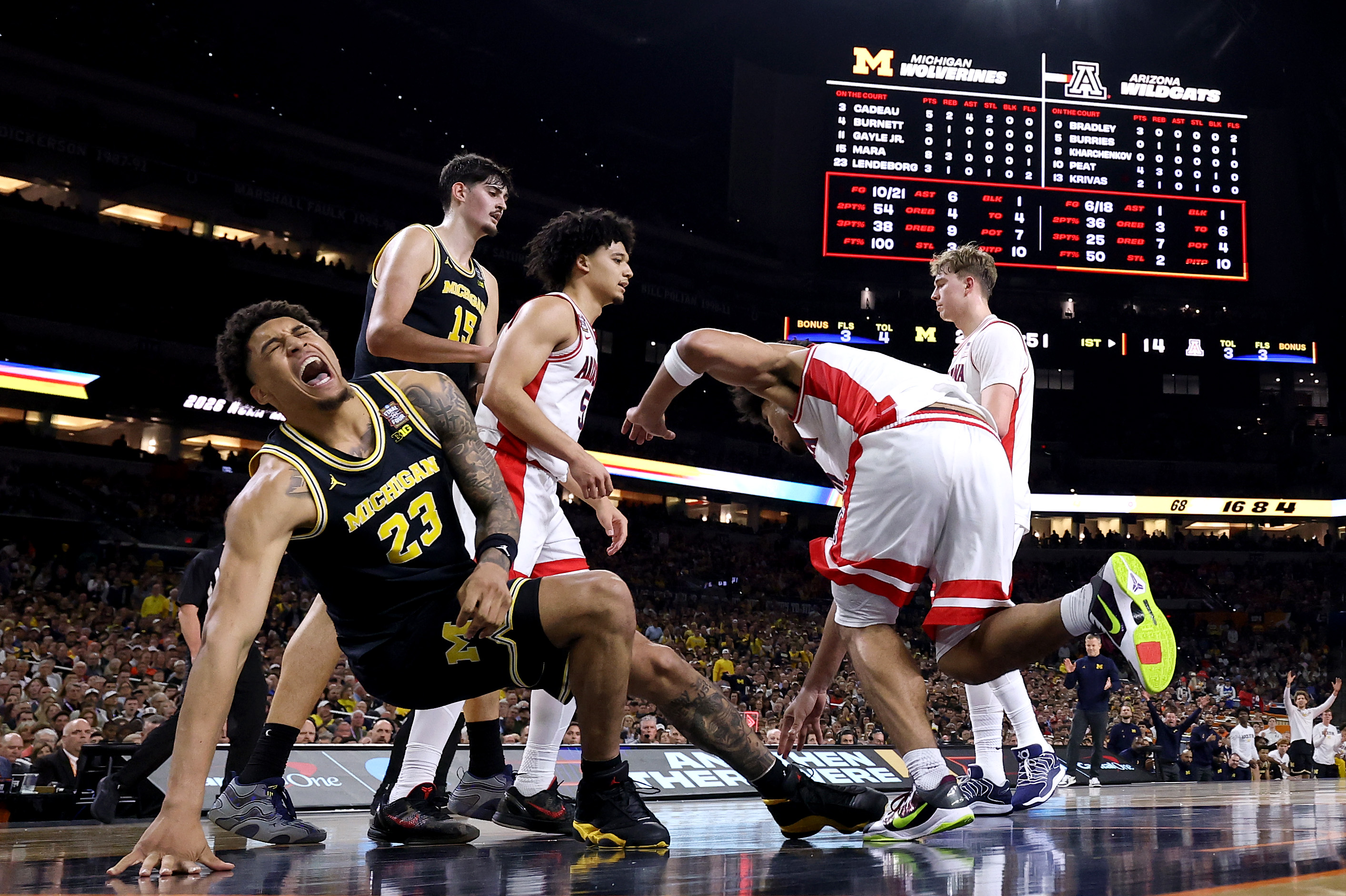 INDIANAPOLIS, INDIANA - APRIL 04: (EDITORS NOTE: Image was captured using a remote camera.) Yaxel Lendeborg #23 of the Michigan Wolverines reacts against the Arizona Wildcats during the  first half in the Final Four of the 2026 NCAA Men's Basketball Tournament at Lucas Oil Stadium on April 04, 2026 in Indianapolis, Indiana. (Photo by Michael Reaves/Getty Images)