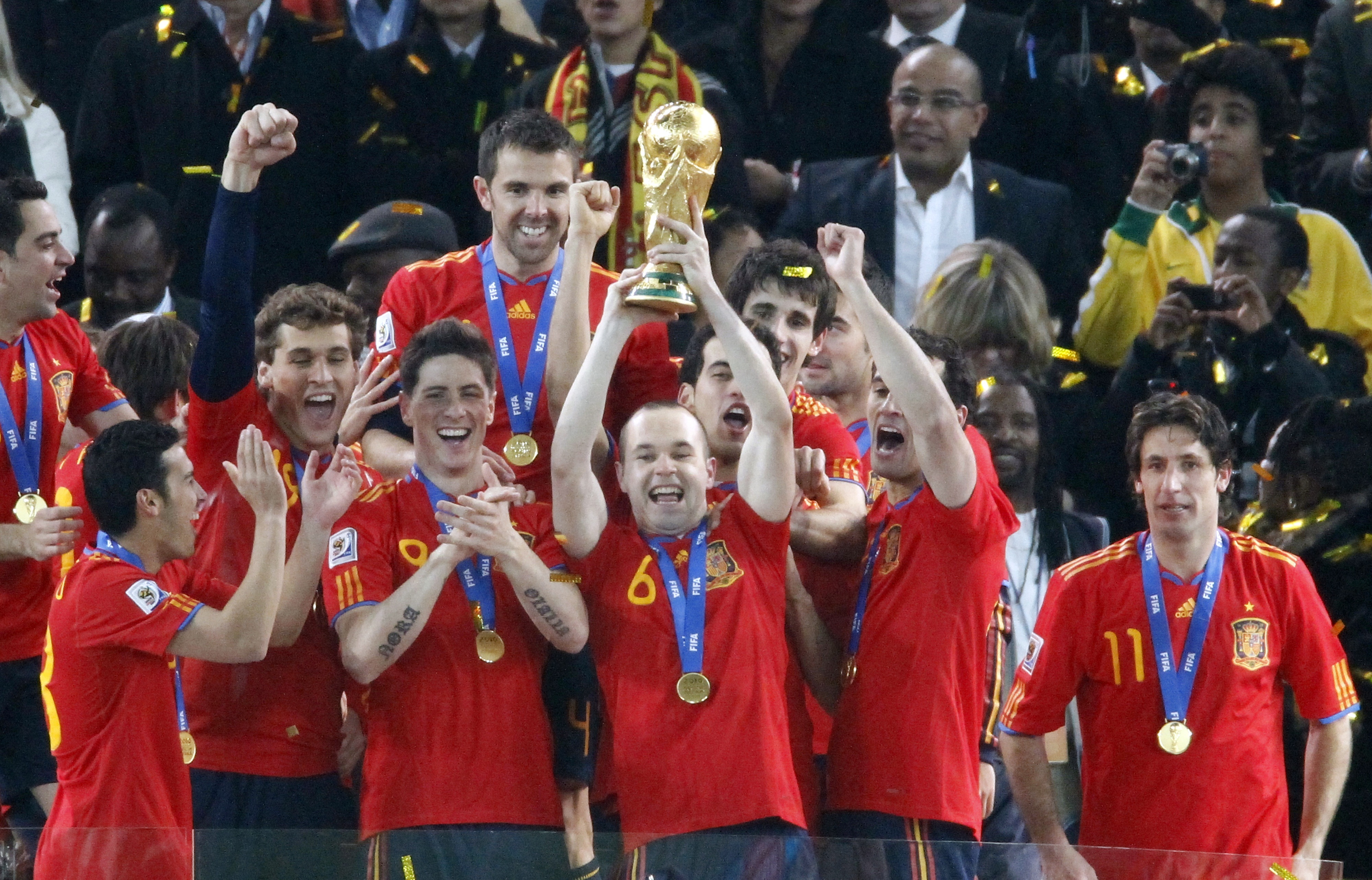 Spain's midfielder Andres Iniesta celebrates with the trophy during the award ceremony following the 2010 FIFA World Cup between the Netherlands and Spain. (THOMAS COEX/AFP via Getty Images)