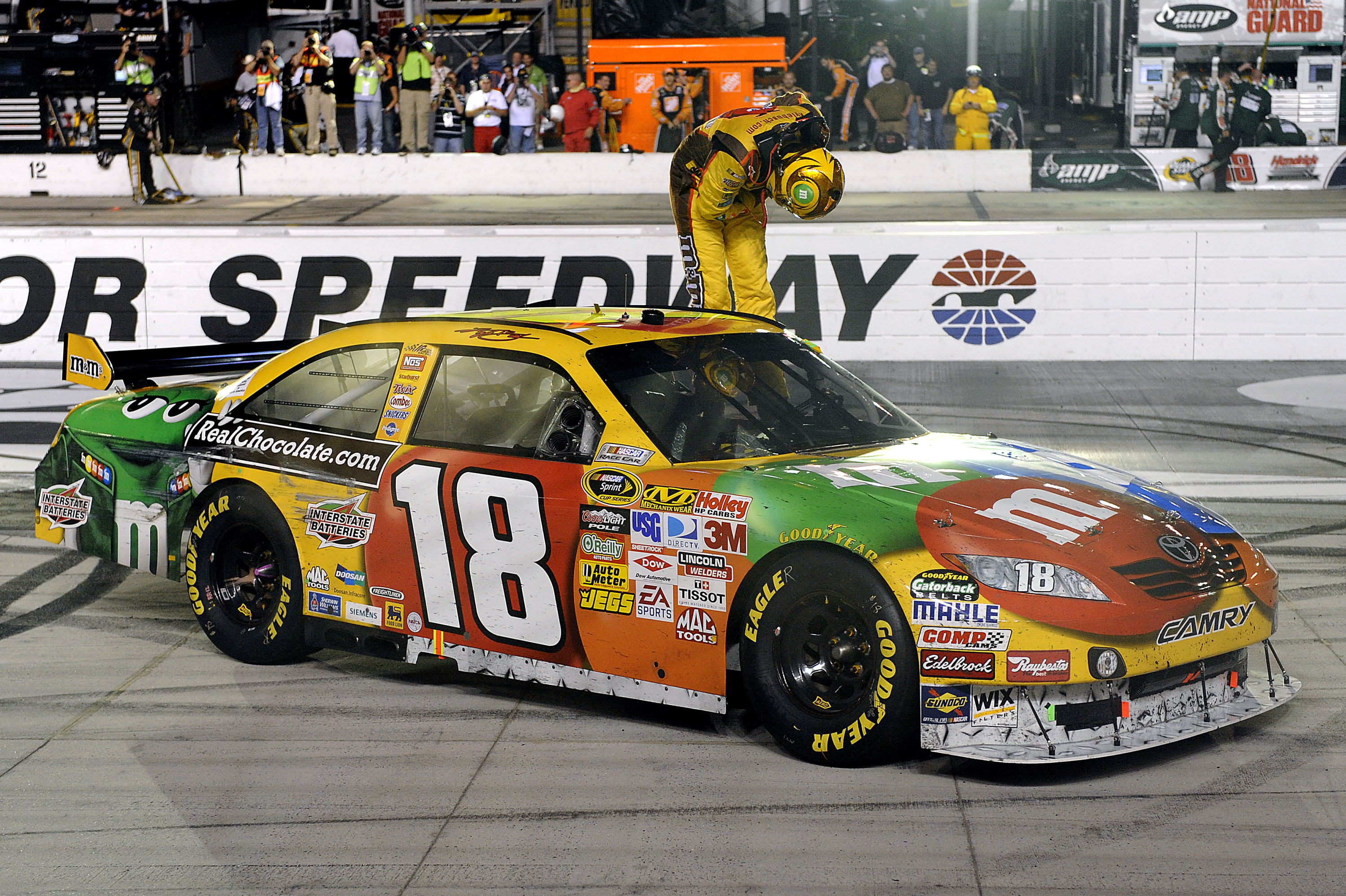 BRISTOL, TN - AUGUST 22:  Kyle Busch, driver of the #18 M&M's Toyota, takes a bow on track after winning the NASCAR Sprint Cup Series Sharpie 500 at Bristol Motor Speedway on August 22, 2009 in Bristol, Tennessee.  (Photo by John Harrelson/Getty Images)