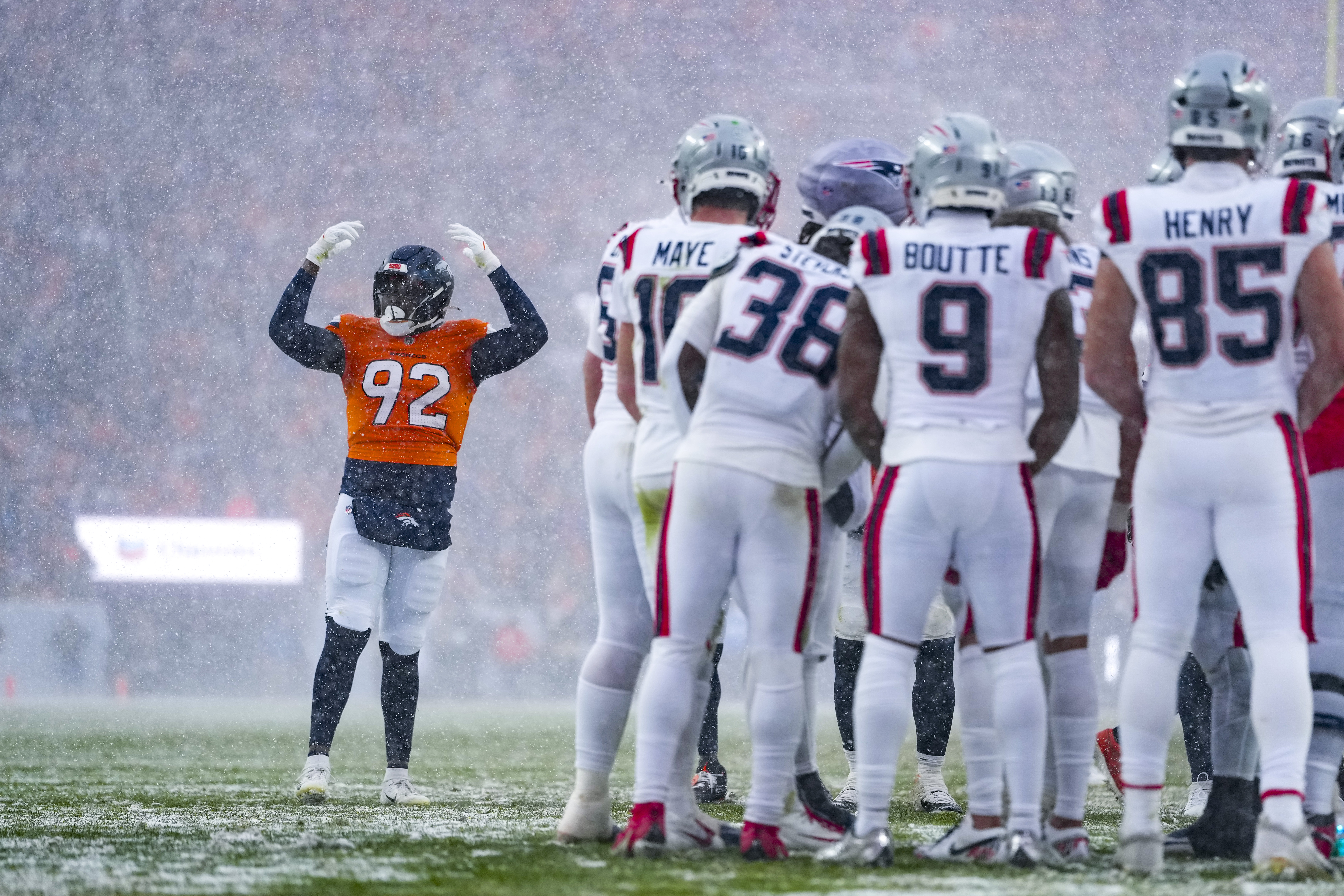 The Broncos and Patriots played the second half of the AFC championship game in a snowstorm. (Photo by Cooper Neill/Getty Images)