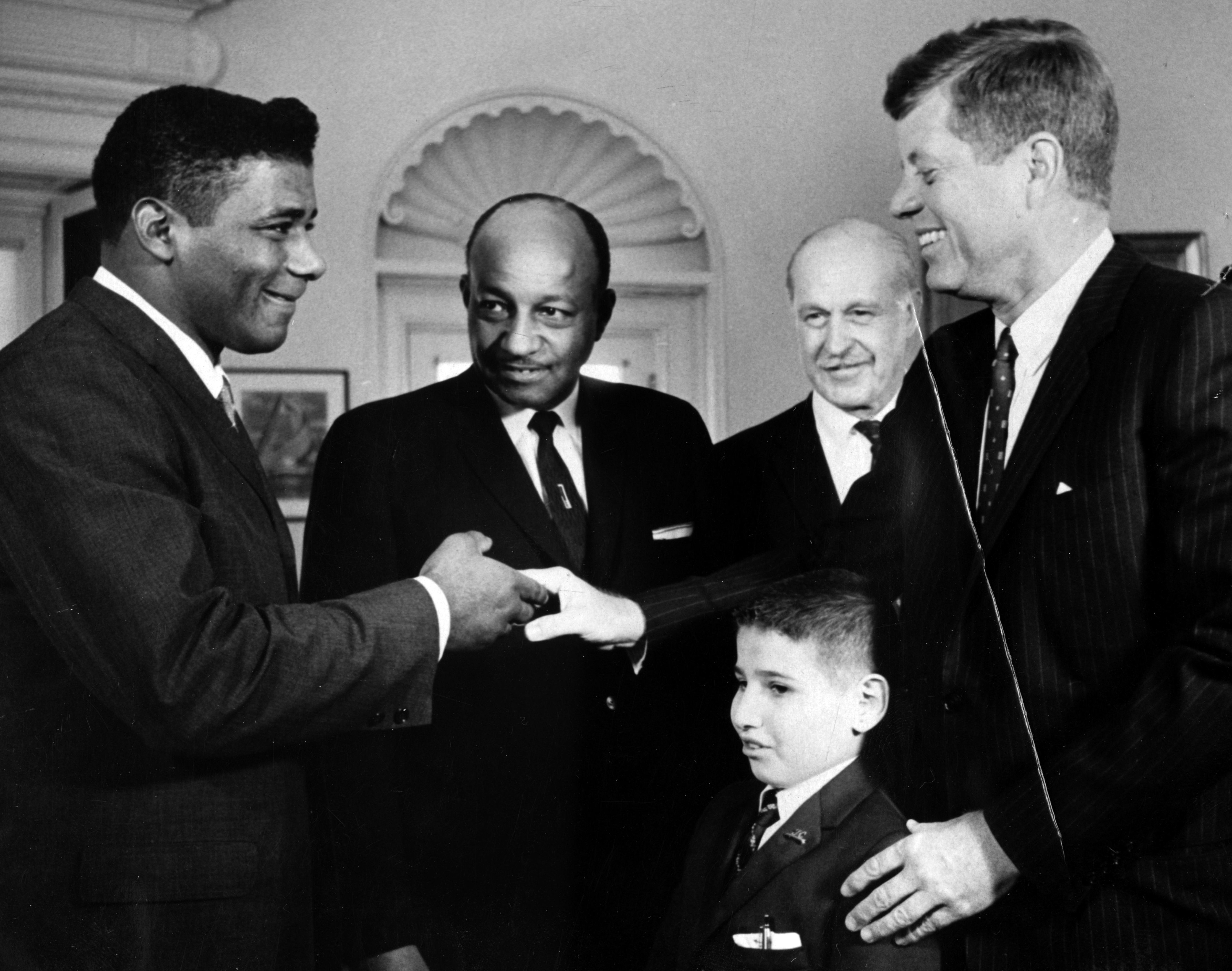 Floyd Patterson, heavyweight champion, shakes hands with President John F Kennedy, Washington, DC, 1961. (Photo by Afro American Newspapers/Gado/Getty Images)