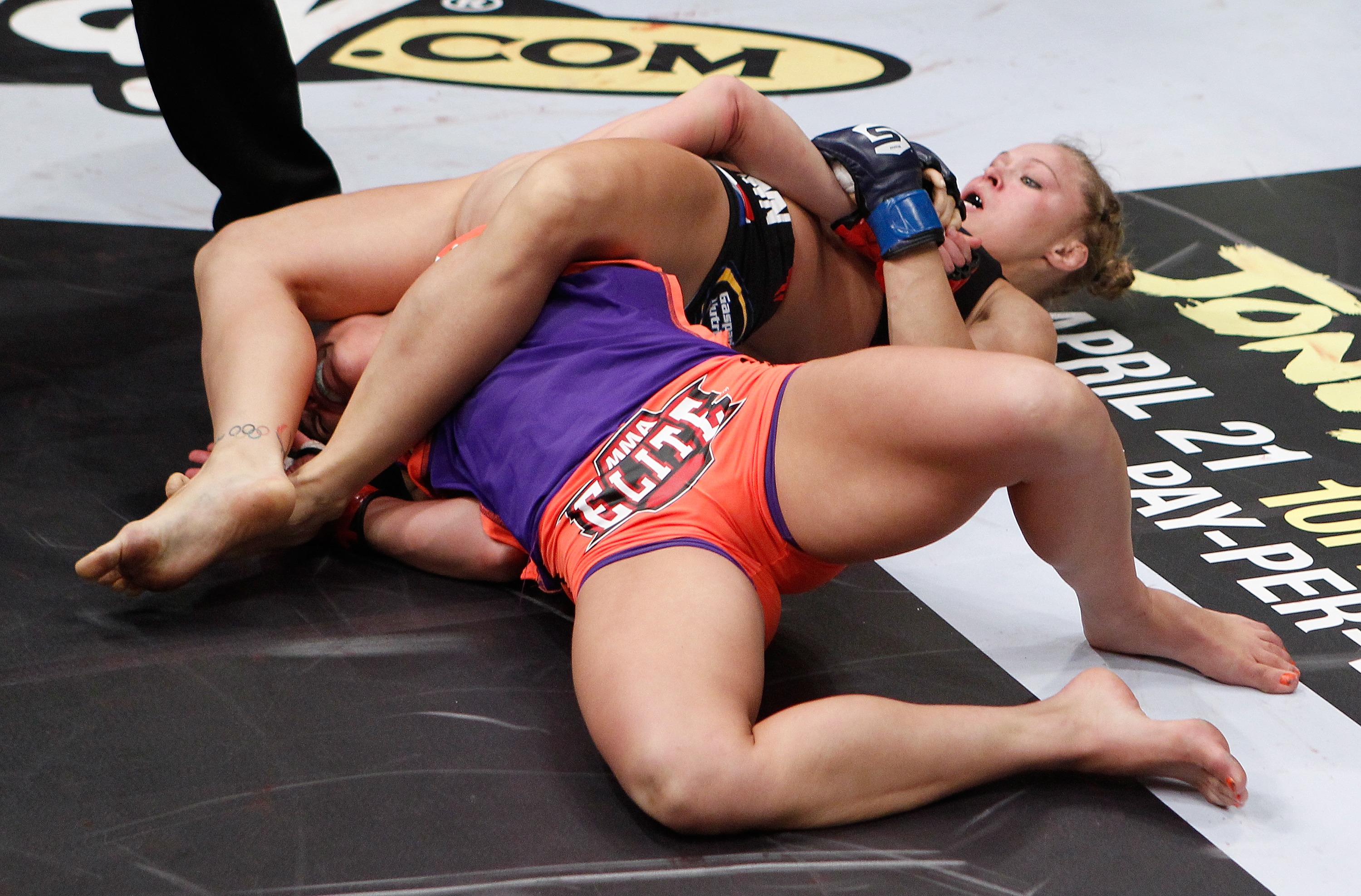 COLUMBUS, OH - MARCH 03:  Ronda Rousey (blue gloves) attempts to submit Miesha Tate during the Strikeforce event at Nationwide Arena on March 3, 2012 in Columbus, Ohio.  (Photo by Esther Lin/Forza LLC/Forza LLC via Getty Images)