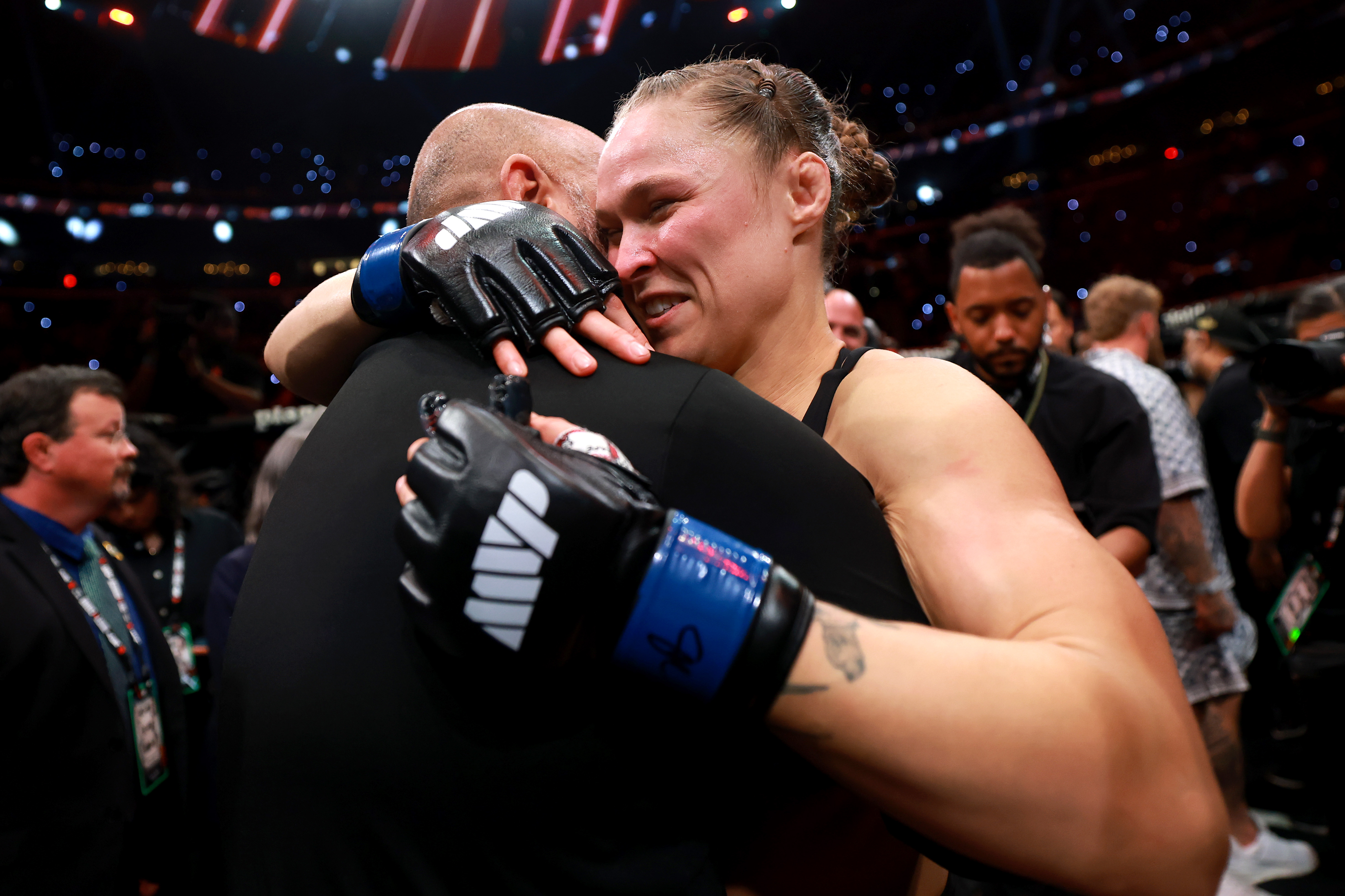 INGLEWOOD, CALIFORNIA - MAY 16: Ronda Rousey and husband Travis Browne embrace after Rousey defeated Gina Carano in her featherweight bout during the main card of Netflix's Ronda Rousey vs. Gina Carano at Intuit Dome on May 16, 2026 in Inglewood, California. (Photo by Sarah Stier/Getty Images for Netflix)
