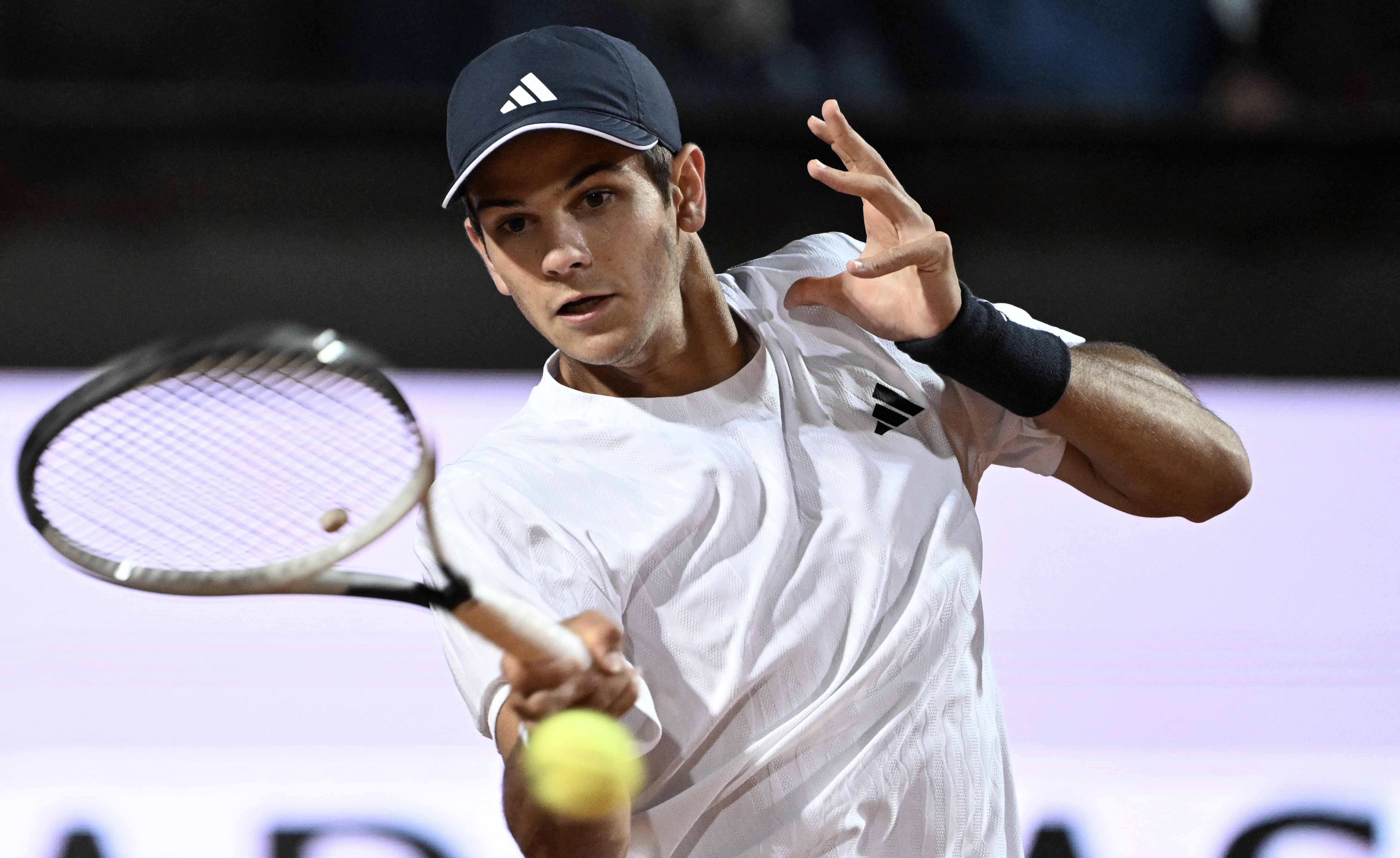 Spain's Rafael Jodar hits a return to Italy's Luciano Darderi during the ATP Rome Open tennis tournament at Foro Italico in Rome on May 13, 2026. (Photo by Tiziana FABI / AFP via Getty Images)