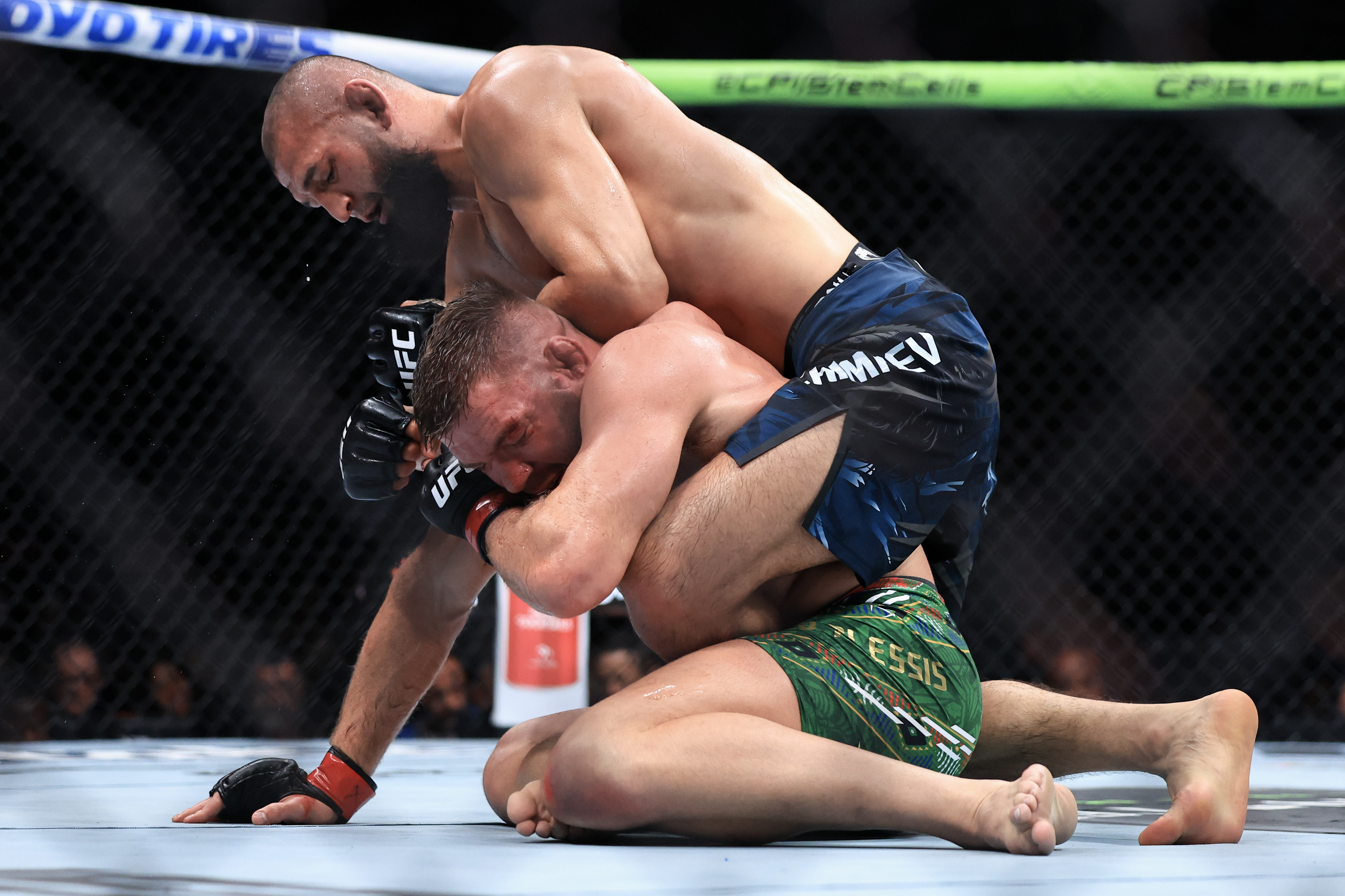 CHICAGO, ILLINOIS - AUGUST 16: Khamzat Chimaev of the United Arab Emirates grapples with Dricus du Plessis of South Africa during their middleweight title bout in UFC 319 at the United Center on August 16, 2025 in Chicago, Illinois. (Photo by Geoff Stellfox/Getty Images)