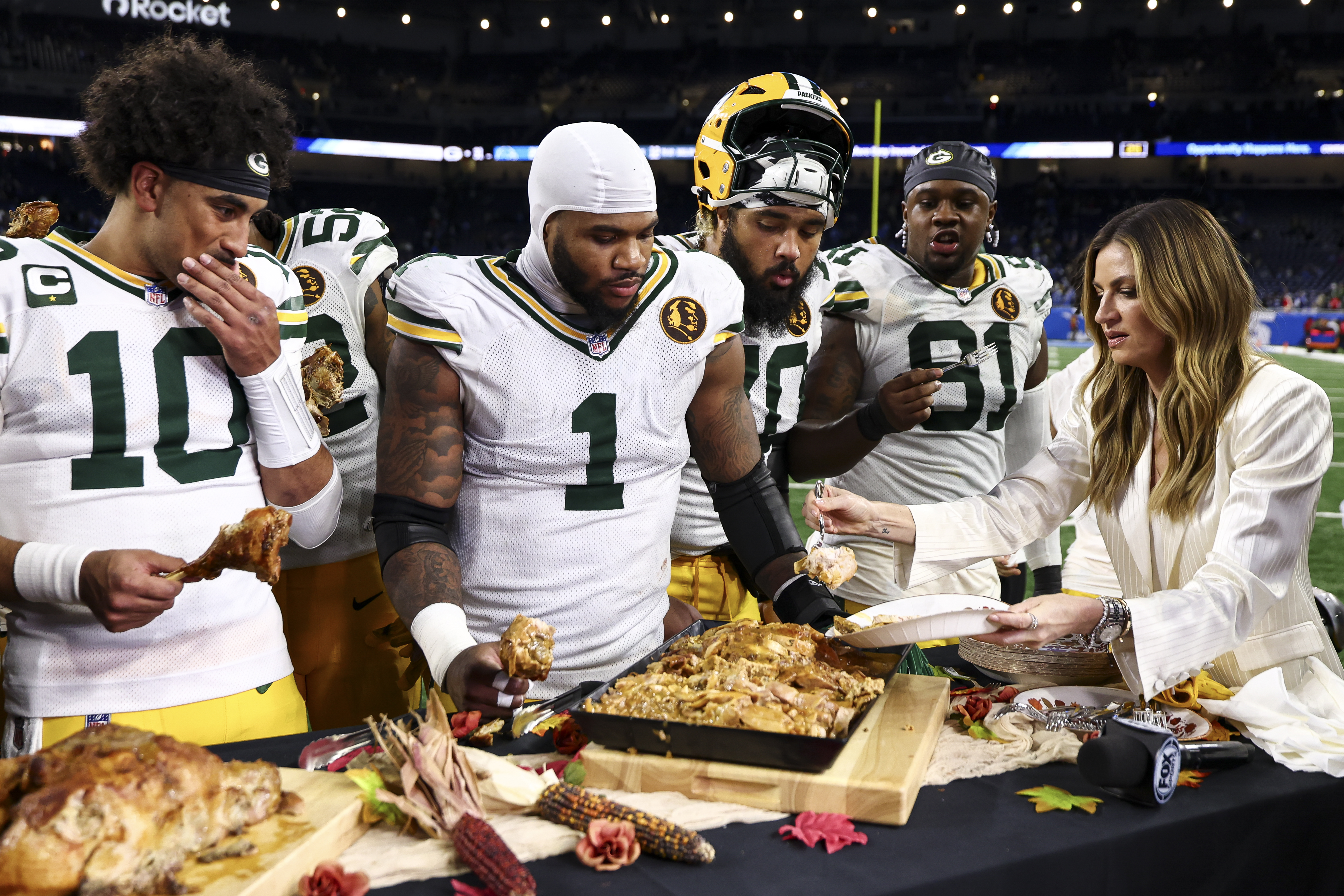 DETROIT, MICHIGAN - NOVEMBER 27: Micah Parsons #1 of the Green Bay Packers eats turkey after an NFL football game against the Detroit Lions at Ford Field on November 27, 2025 in Detroit, Michigan. (Photo by Kevin Sabitus/Getty Images)
