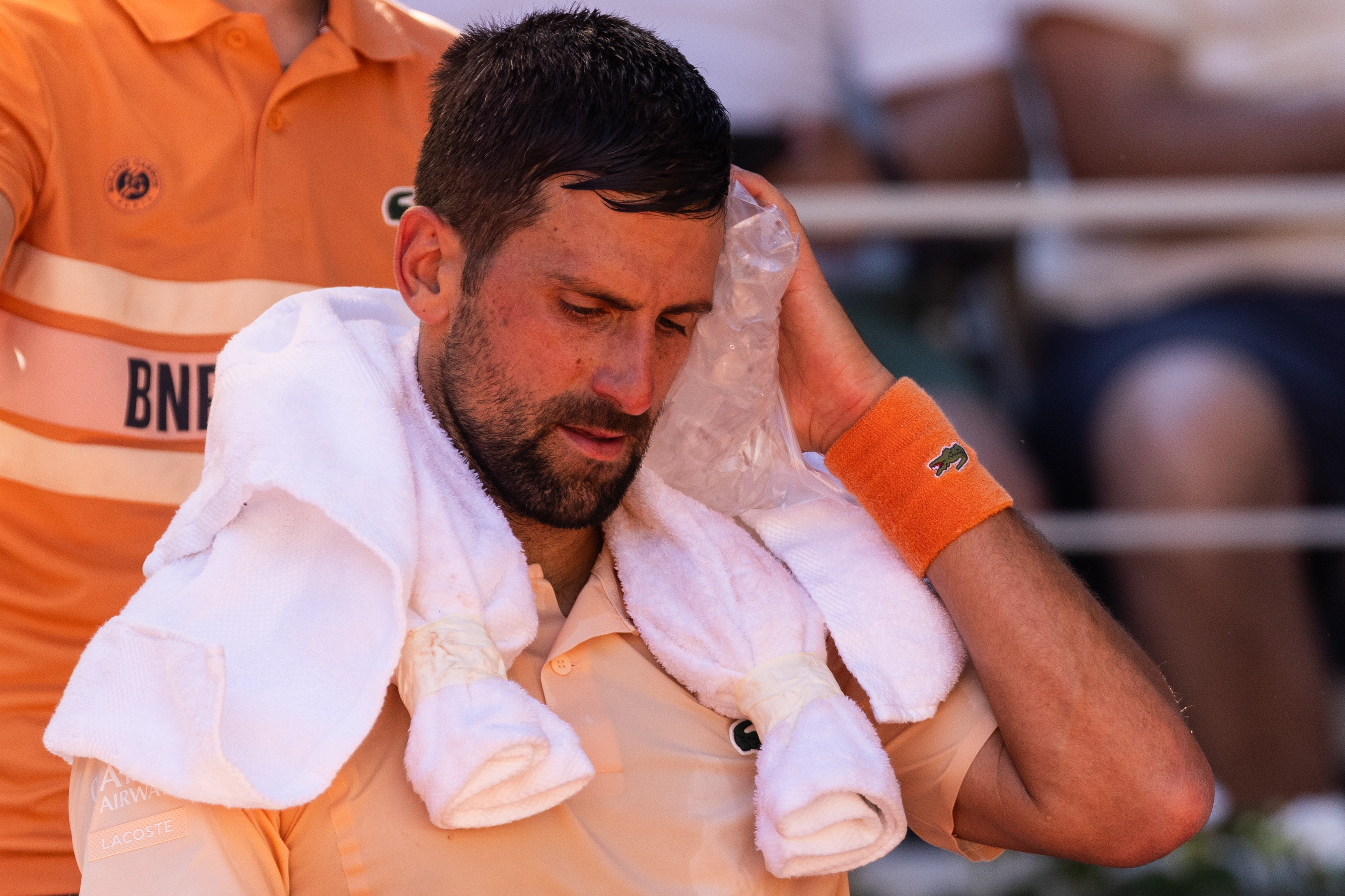 Novak Djokovic uses ice cubes to cool down during his men's singles match against Valentin Royer on day 4 of the French Open tennis tournament on Court Philippe-Chatrier at the Roland-Garros Complex in Paris, France. (Photo by Ibrahim Ezzat/NurPhoto via Getty Images)