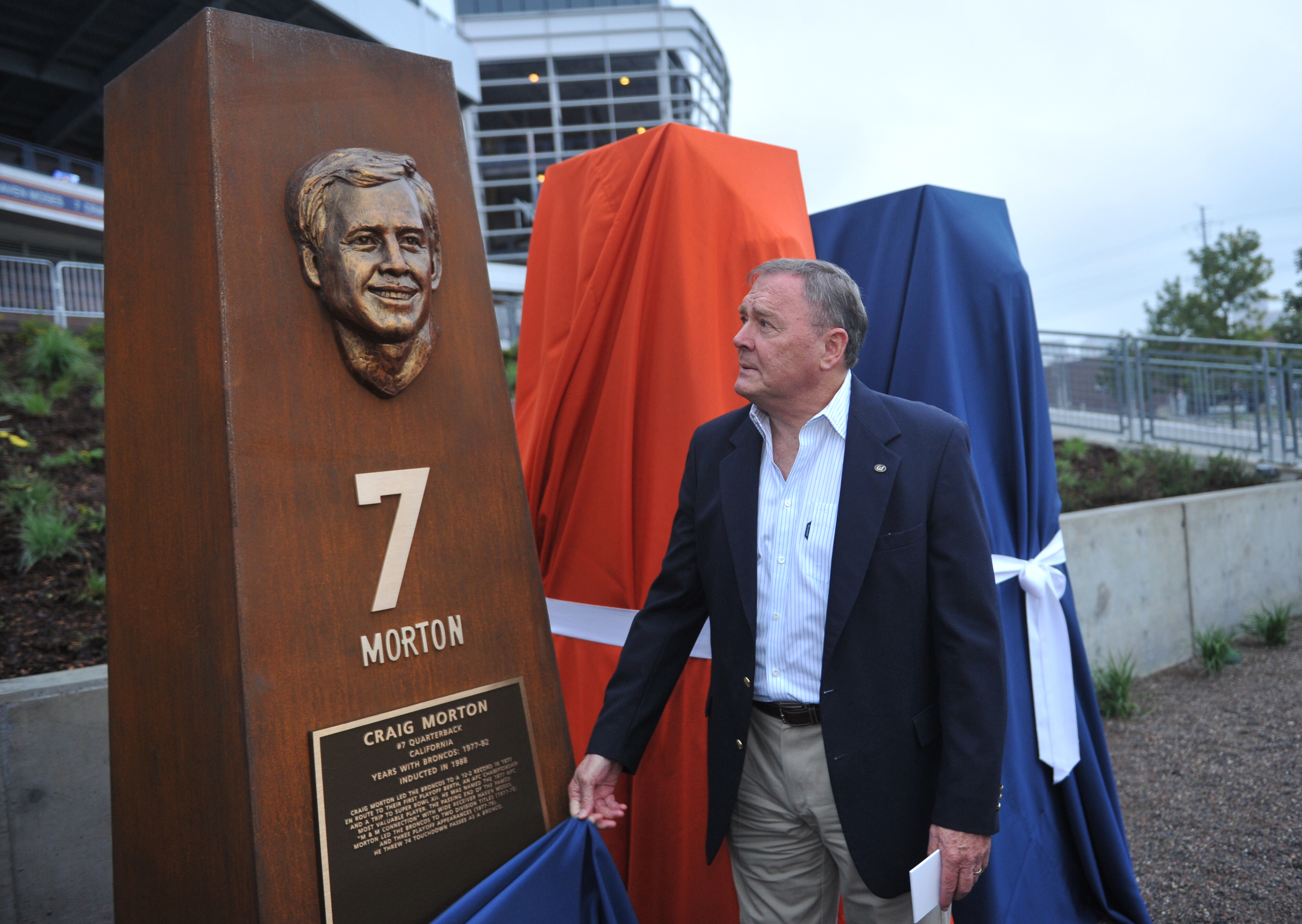 DENVER, CO - September 27 : Quarterback Craig Morton is unveiling the sculpture at the Denver Broncos Ring of Fame Plaza in Sports Authority Field at Mile High. Denver, Colorado. September 27, 2013. The Plaza feature pillars honoring each of the 24 players in the Broncos Ring of Fame. (Photo by Hyoung Chang/The Denver Post via Getty Images)