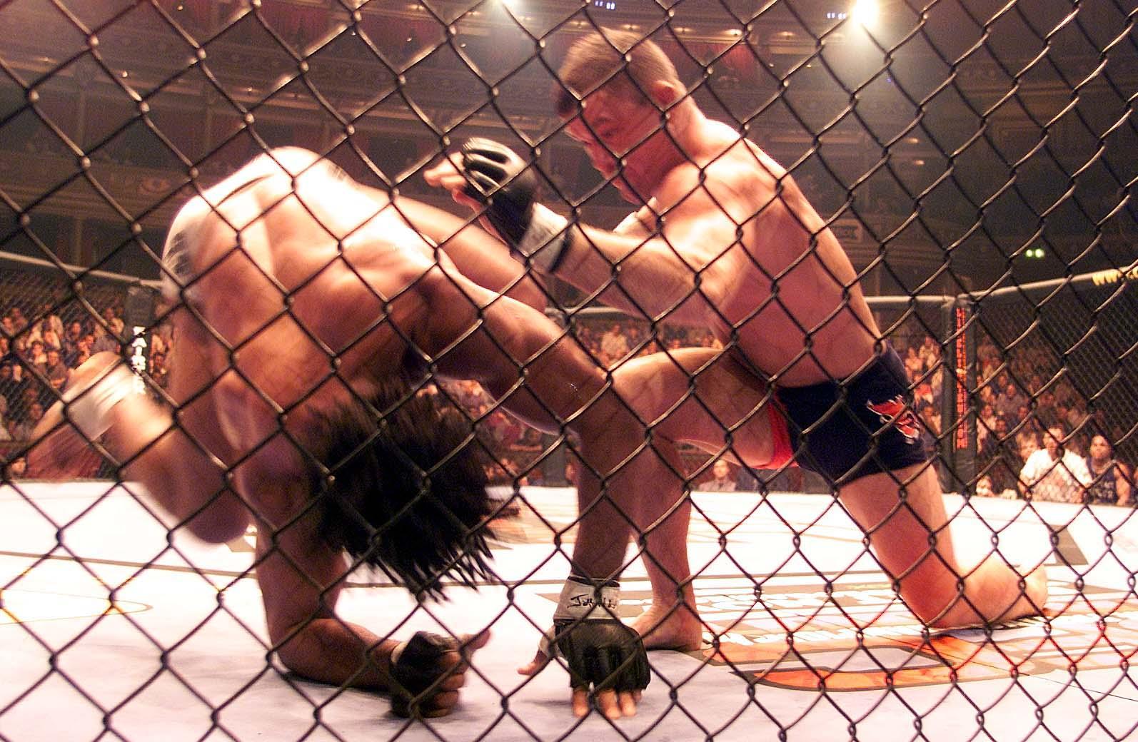 Carlos Newton  (L) from Newmarket, Canada and Matt Hughes from Hillsboro ,USA, in action during their Ultimate Fighting Championship (UFC) Welterweight world title match up at the Albert  Hall in London.  Hughes won the bout when the refere stopped the fight.   (Photo by Sean Dempsey - PA Images/PA Images via Getty Images)