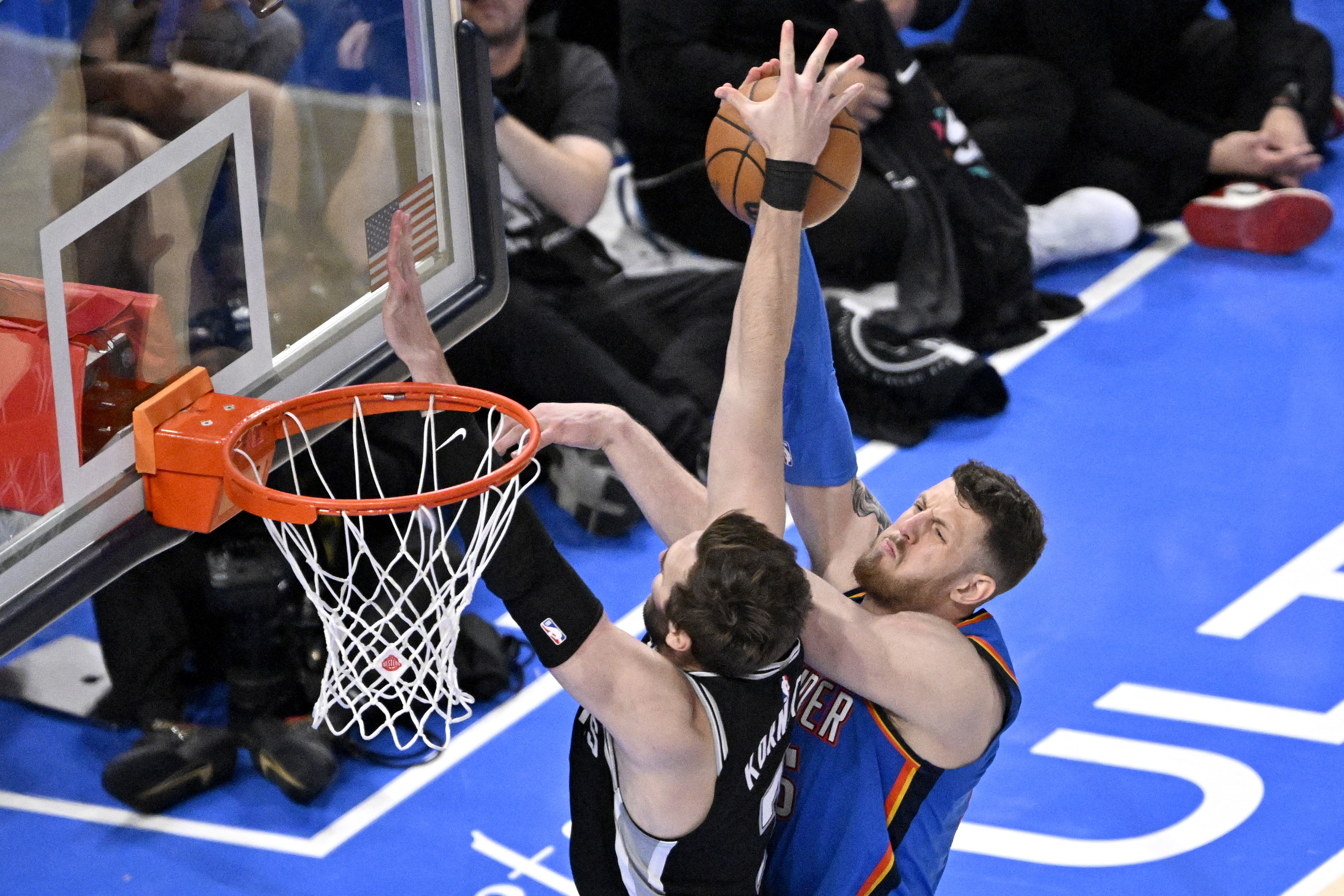 May 30, 2026; Oklahoma City, Oklahoma, USA; San Antonio Spurs center Luke Kornet (7) blocks Oklahoma City Thunder center Isaiah Hartenstein (55) in the fourth quarter during game seven of the western conference finals for the 2026 NBA playoffs at Paycom Center. Mandatory Credit: Jerome Miron-Imagn Images