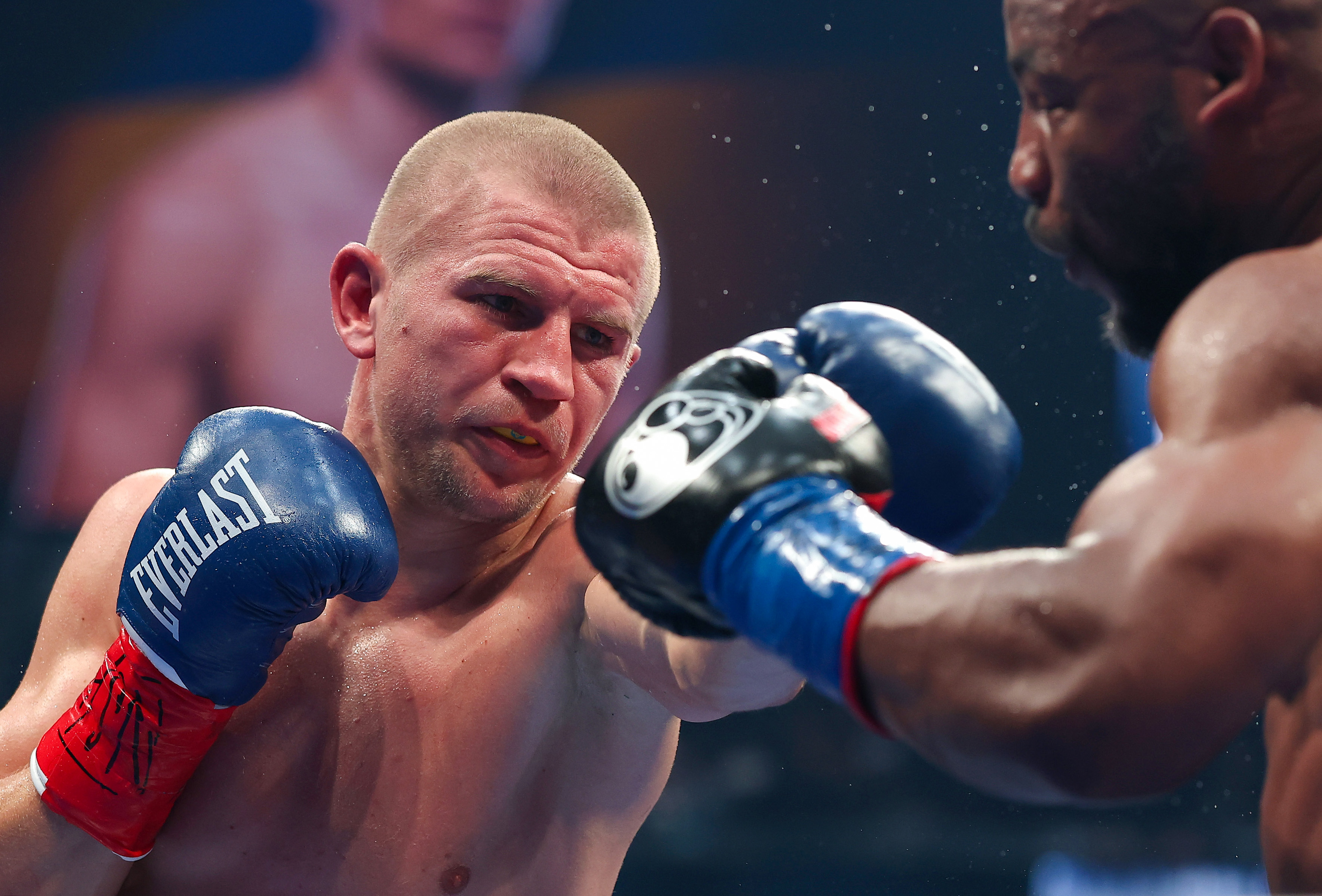 LAS VEGAS, NEVADA - SEPTEMBER 13: (L-R) Serhii Bohachuk punches Brandon Adams in their middleweight bout during Netflix's Canelo v Crawford Fight Night at Allegiant Stadium on September 13, 2025 in Las Vegas, Nevada.  (Photo by Sarah Stier/Getty Images for Netflix)