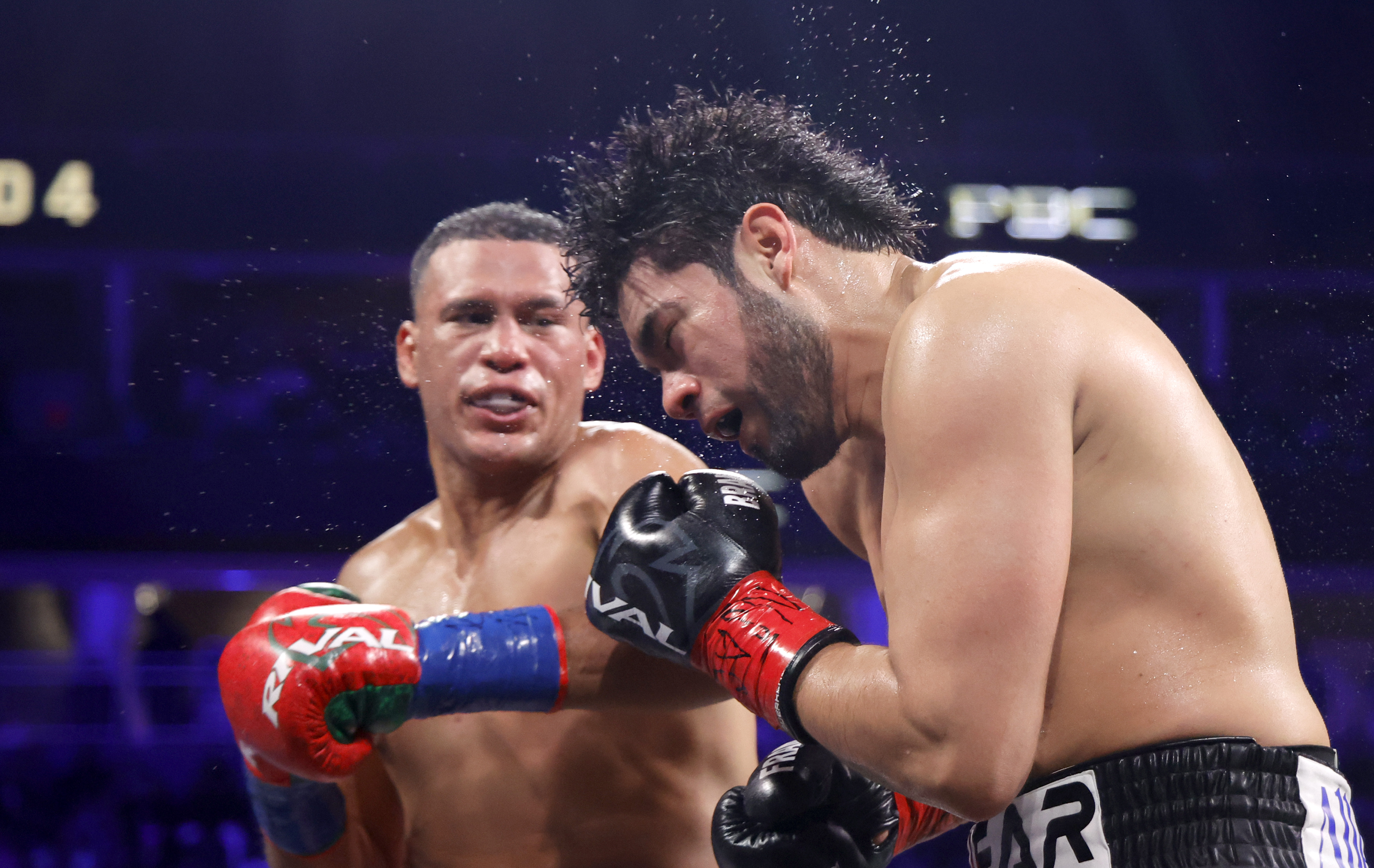 LAS VEGAS, NEVADA - MAY 02: WBA/WBO cruiserweight champion Gilberto Ramirez takes a punch from David Benavidez during a title fight at T-Mobile Arena on May 02, 2026 in Las Vegas, Nevada. Benavidez took the titles with a sixth-round TKO. (Photo by Steve Marcus/Getty Images)