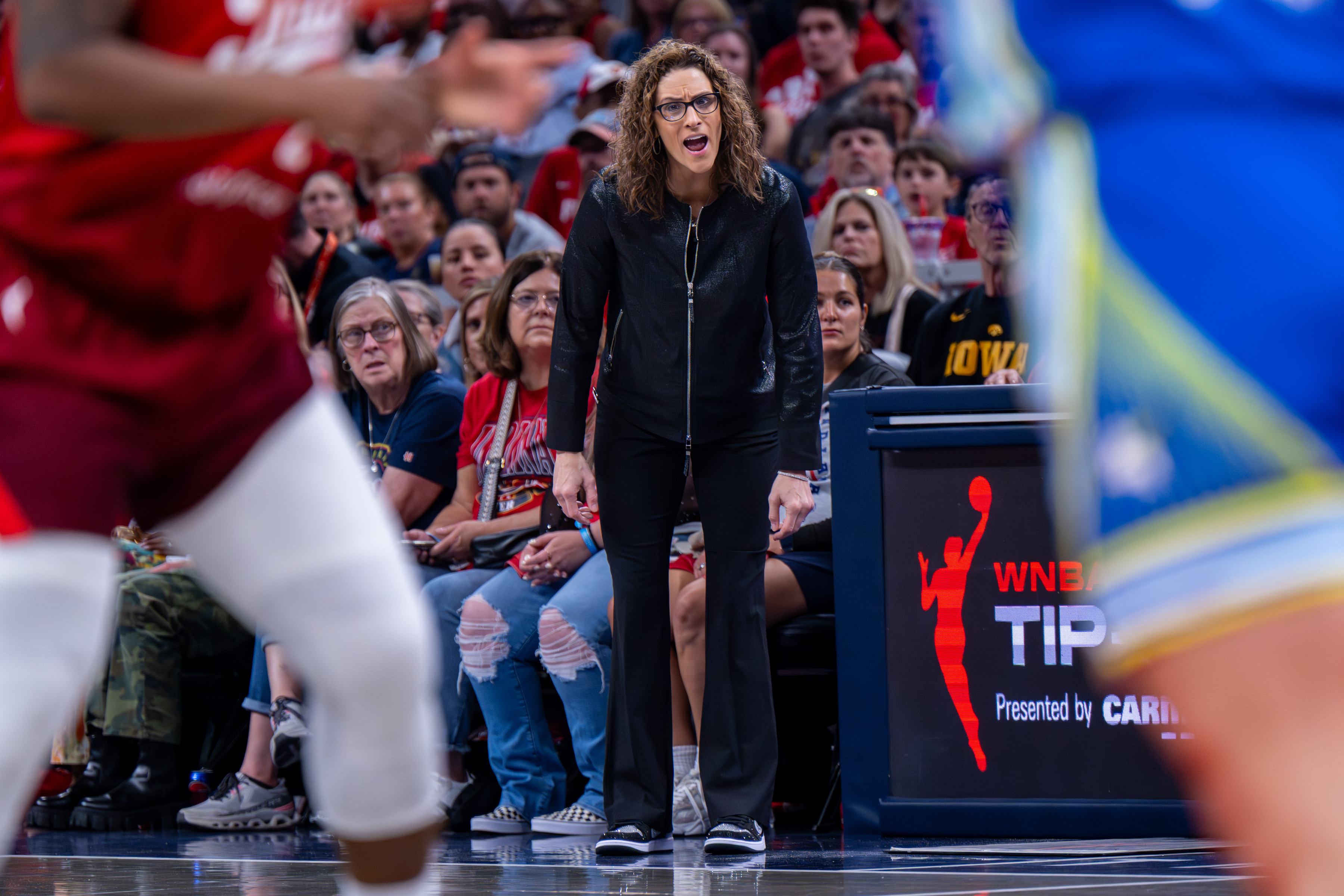 Indiana Fever head coach Stephanie White reacts during the first half of an WNBA basketball game against the Dallas Wings in Indianapolis, Saturday, May 9, 2026. (AP Photo/Doug McSchooler)