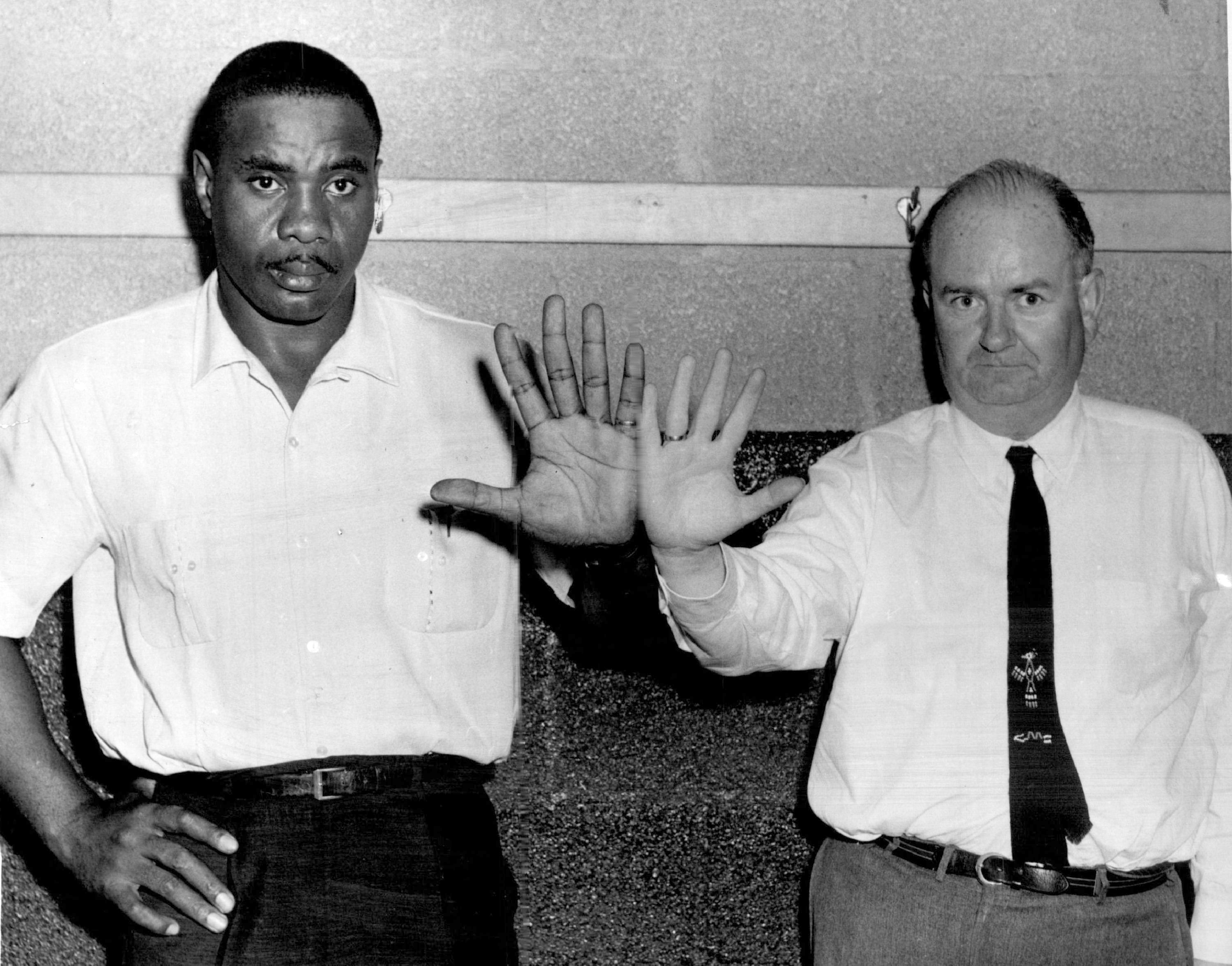 JUL 8 1960, JUL 10 1960 Sonny's Hand Dwarfs that of "Fighting" Post Reporter The guy on the left with the giant hands is Sonny Liston, No. 1 heavyweight boxing contender, who will face Zora Folley, ranked No. 2, in Denver's Coliseum July 18. Just for comparison, Denver Post boxing writer Jim Graham puts his average-sized hand up against Liston's. Graham wears size 8 glove. Liston's big ham takes size 13 glove. Credit: Dean Rogers-Hopwood, Inc.  (Denver Post via Getty Images)