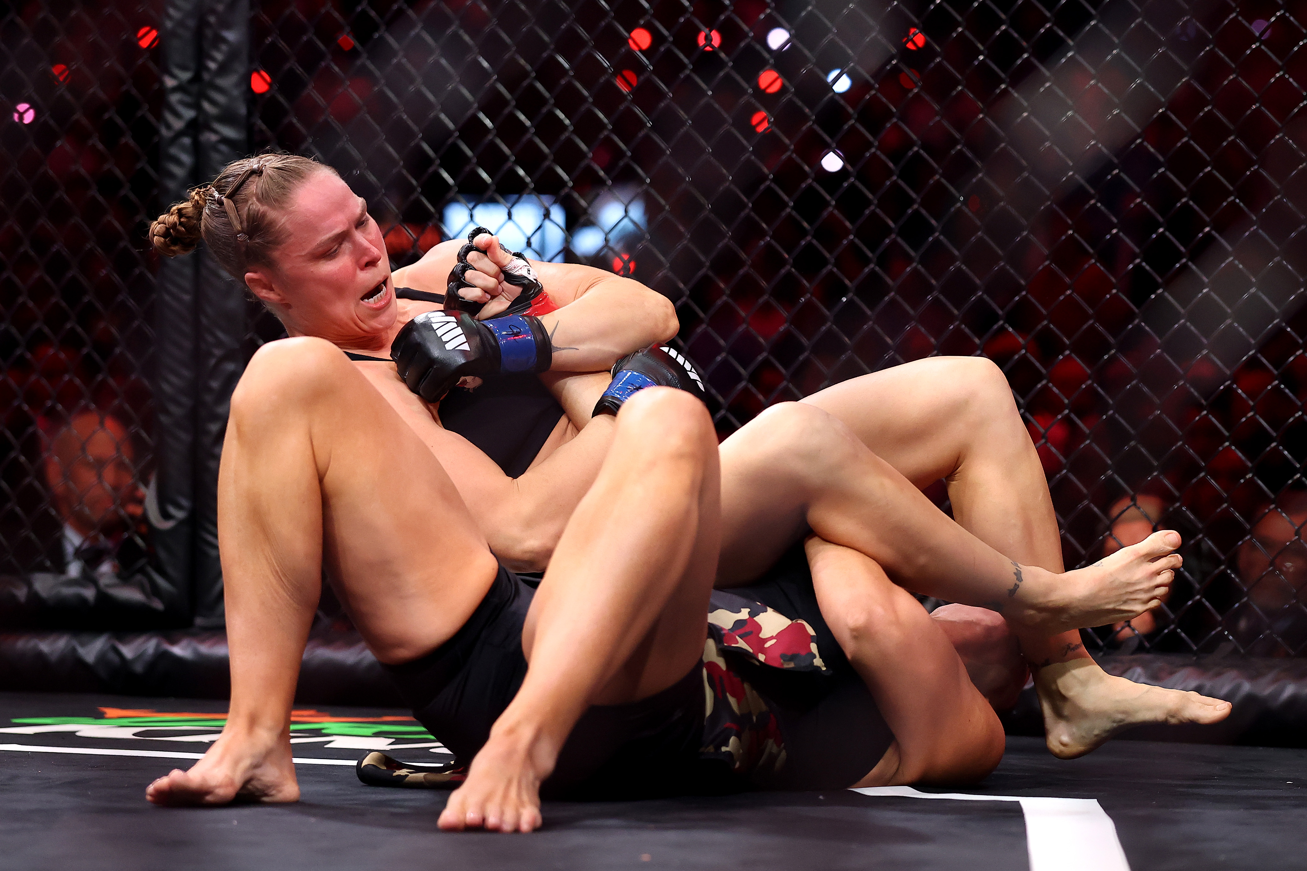 Ronda Rousey forces Gina Carano into an armbar submission in their featherweight bout during the main card of Netflix's Ronda Rousey vs. Gina Carano at Intuit Dome on May 16, 2026 in Inglewood, California. (Photo by Sarah Stier/Getty Images for Netflix)