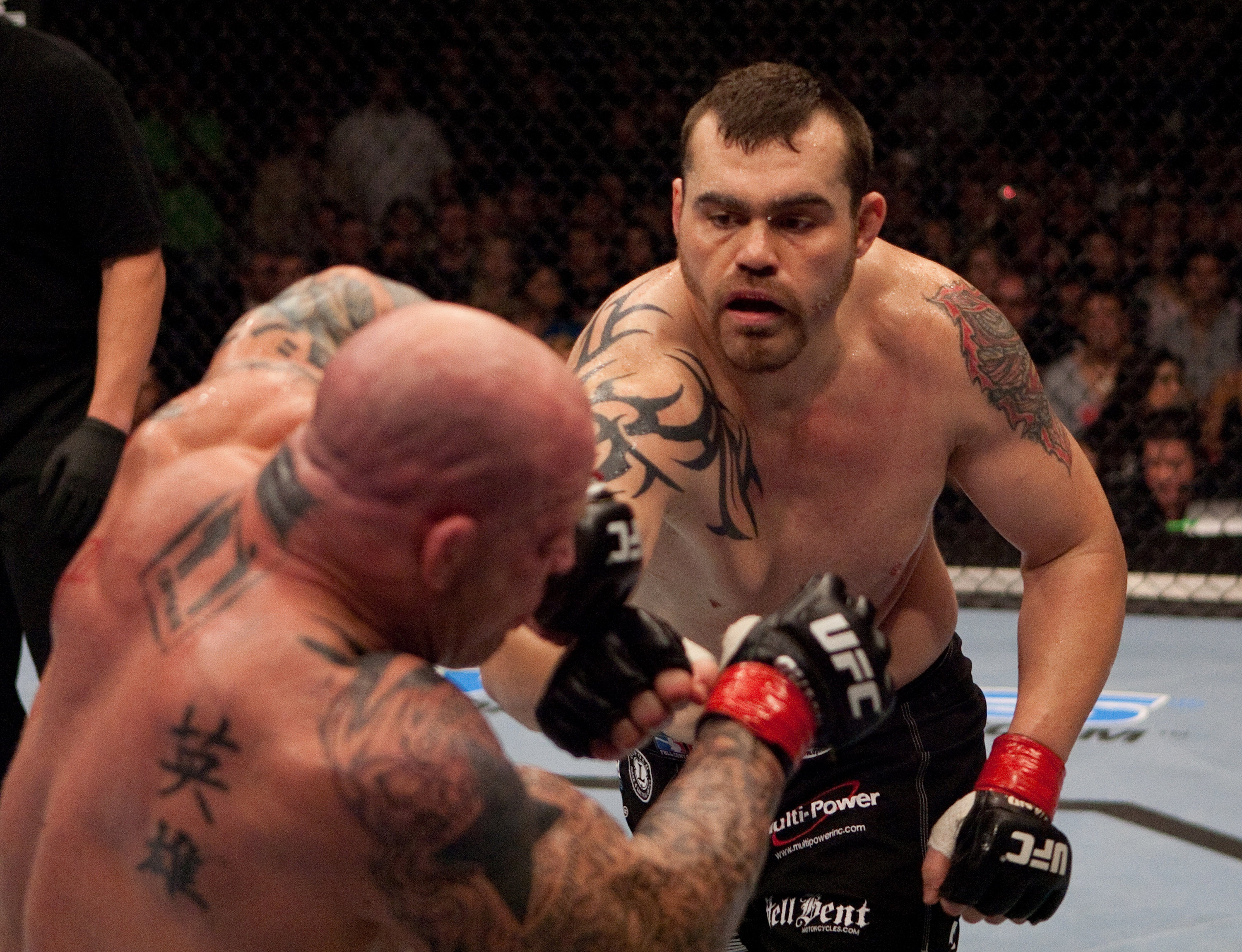 SACRAMENTO - NOVEMBER 18:  (R-L) Tim Sylvia punches Jeff Monson at  UFC 65 at the Arco Arena on November 18, 2006 in Sacramento, California.  (Photo by Josh Hedges/Zuffa LLC/Zuffa LLC via Getty Images)