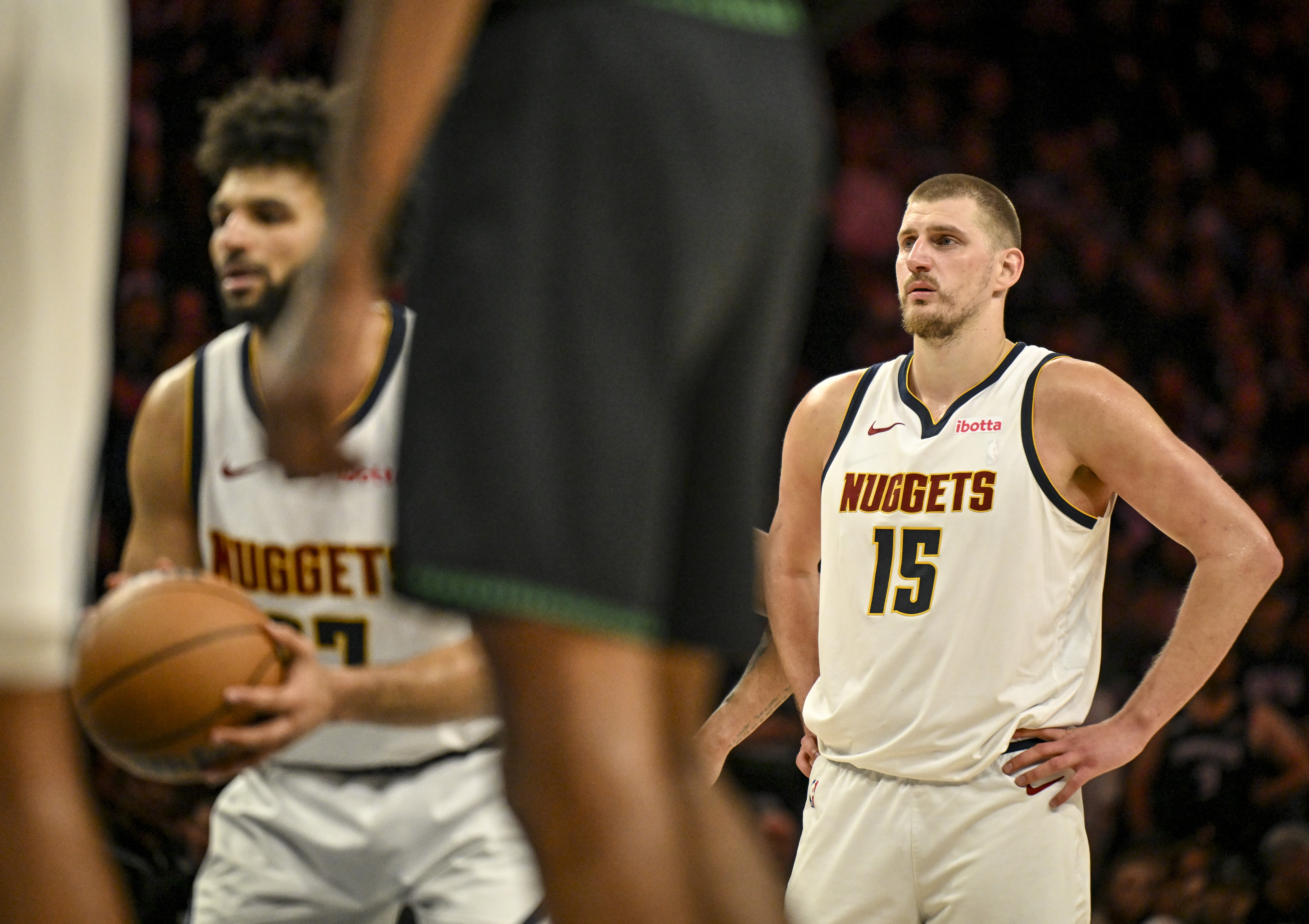 MINNEAPOLIS , MN - APRIL 30: Nikola Jokic (15) of the Denver Nuggets watches as Jamal Murray (27) shoots free throws during the fourth quarter of the Minnesota Timberwolves' 110-98 Game 6 NBA Playoffs series win at the Target Center in Minneapolis, Minnesota on Thursday, April 30, 2026. Minnesota eliminated the Nuggets 4-2. (Photo by AAron Ontiveroz/The Denver Post)