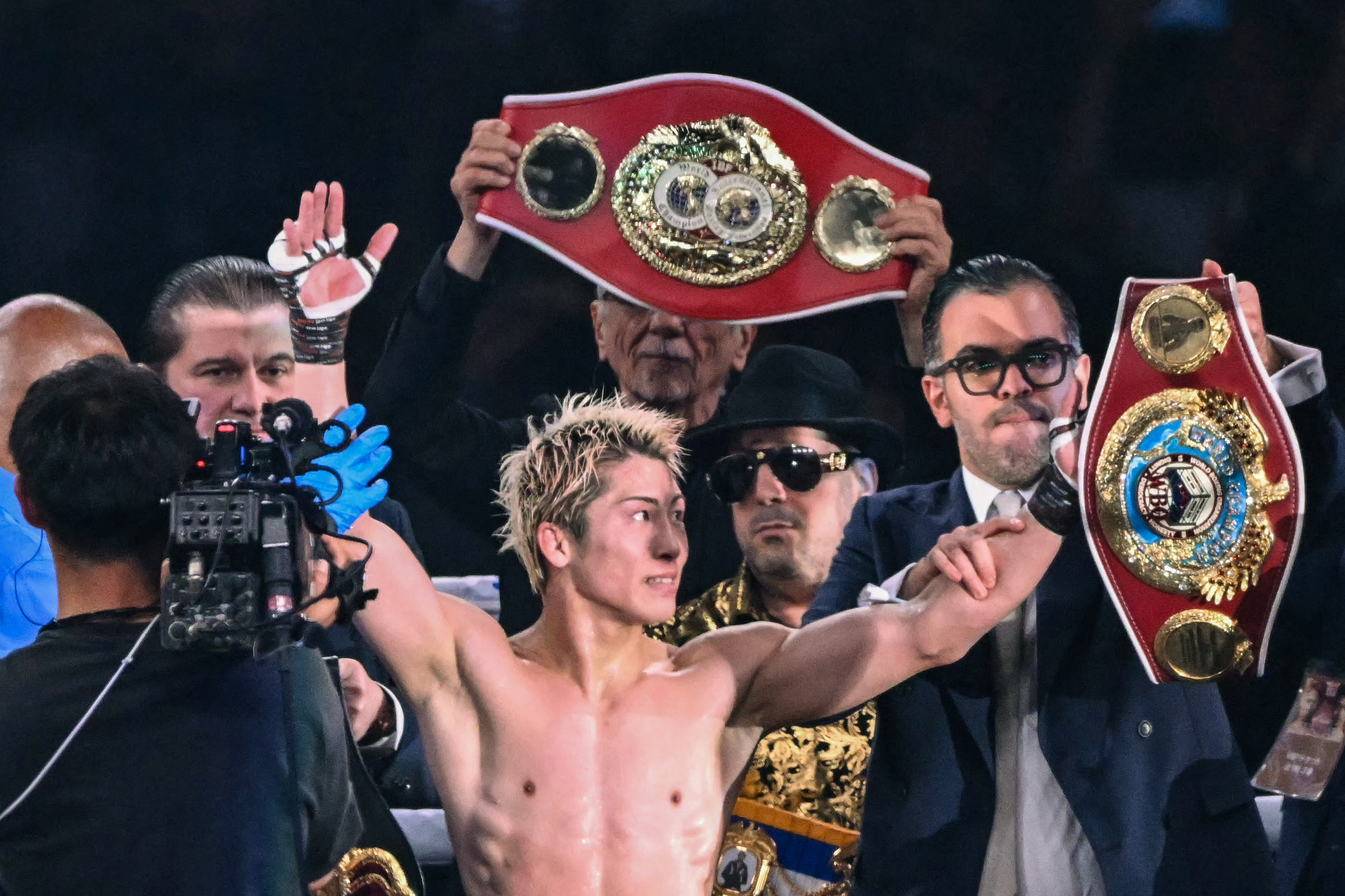 Naoya Inoue (C) celebrates defeating Junto Nakatani in their super bantamweight championship boxing contest at Tokyo Dome in Tokyo on May 2, 2026. (Photo by Yuichi YAMAZAKI / AFP via Getty Images)