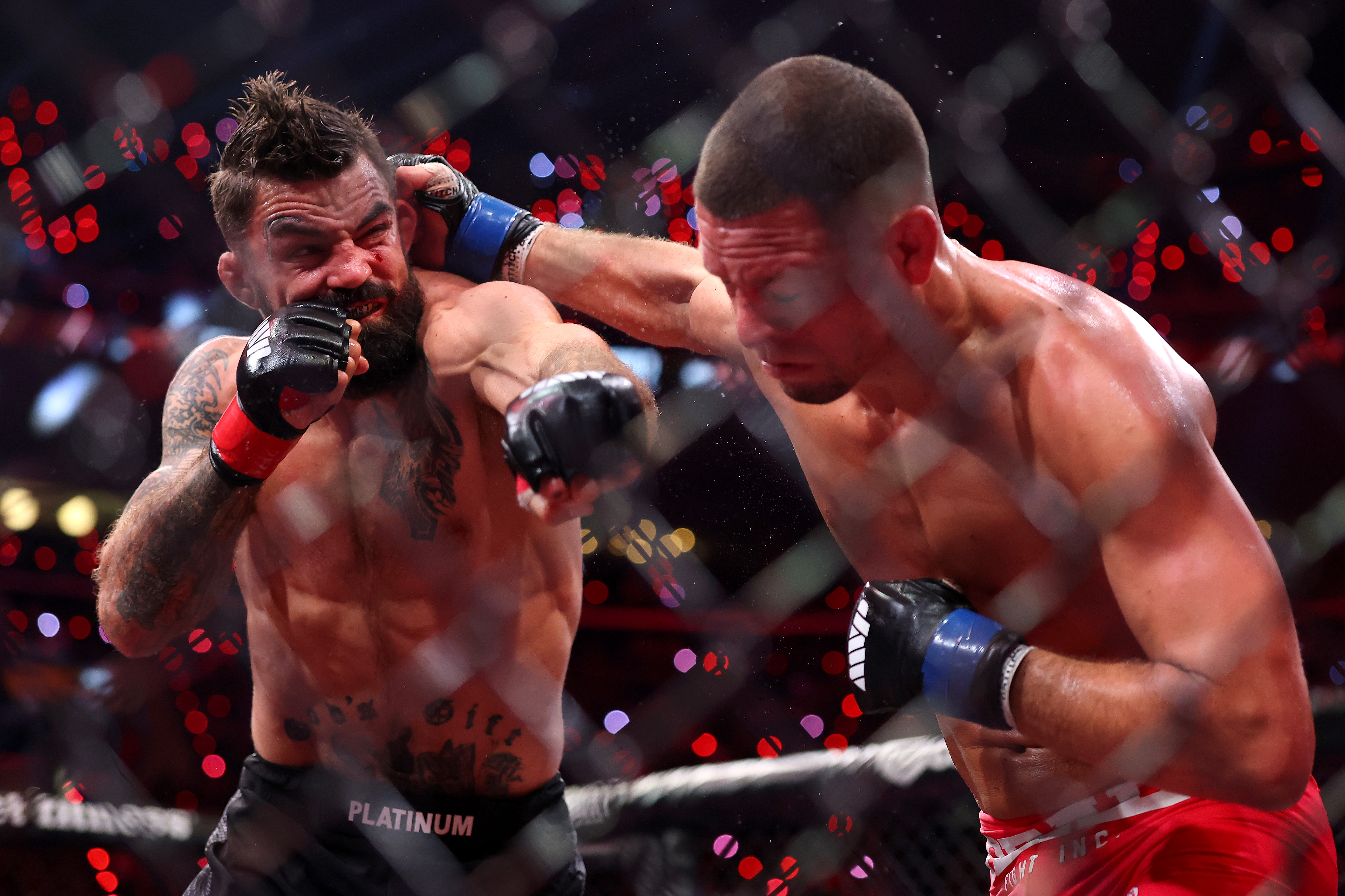INGLEWOOD, CALIFORNIA - MAY 16: Mike Perry and Nate Diaz exchange punches in their welterweight bout during the main card of Netflix's Ronda Rousey vs. Gina Carano at Intuit Dome on May 16, 2026 in Inglewood, California. (Photo by Sarah Stier/Getty Images for Netflix)