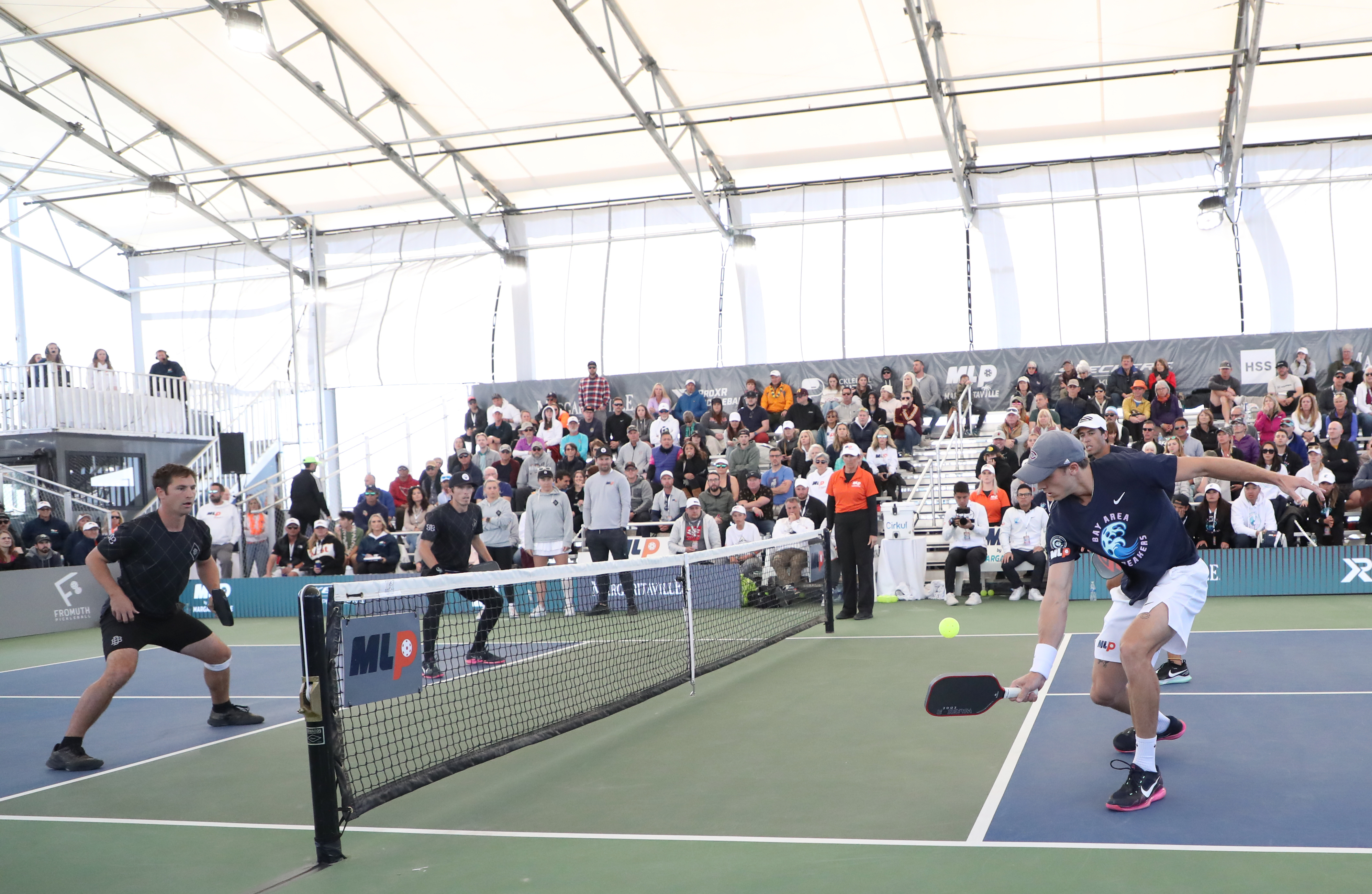 MESA, AZ - JANUARY 29: Christian Alshon of the Bay Area Breakers hits a backhand slice dink shot against Robert Cassidy and Spencer Smith of the Utah Black Diamonds during the MLP Mesa Challenger League Championships at Legacy Sports USA on January 29, 2023 in Mesa, Arizona. (Photo by Bruce Yeung/Getty Images)