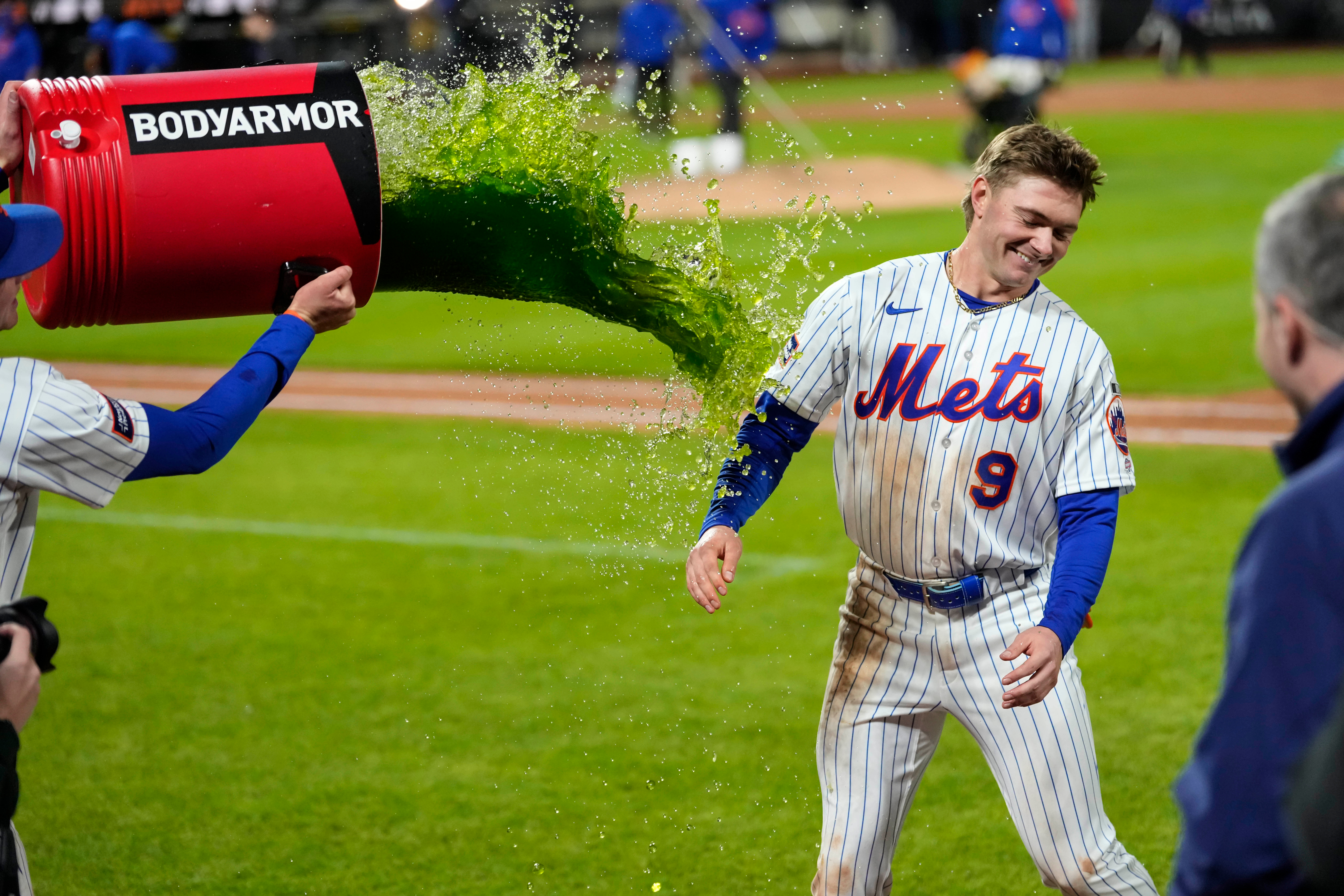New York Mets center fielder A.J. Ewing (9) is dunked with gatorade after winning a baseball game against the Detroit Tigers, Tuesday, May 12, 2026, in New York. (AP Photo/Yuki Iwamura)