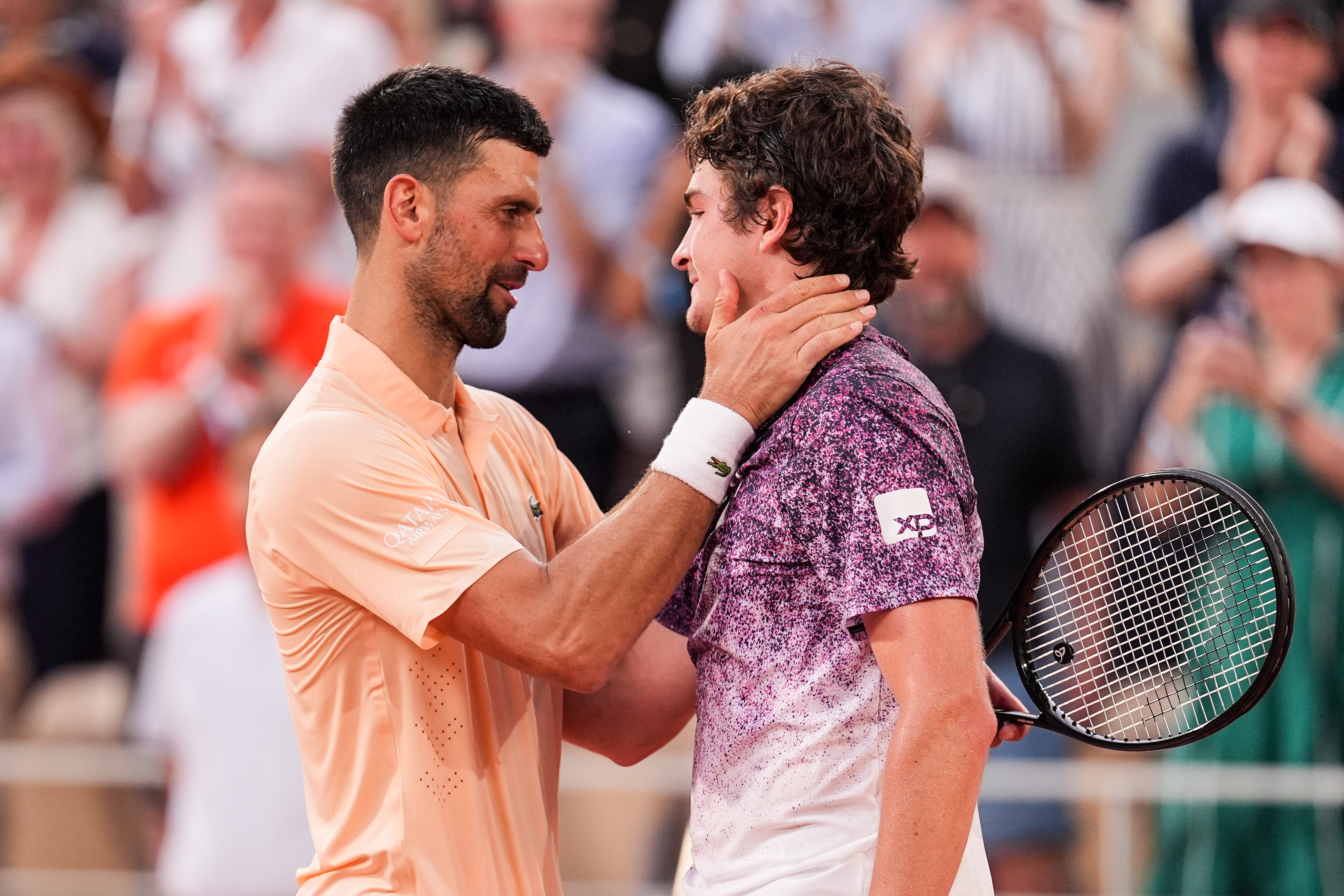 PARIS, FRANCE - MAY 29: Joao Fonseca (R) of Brazil greets Novak Djokovic of Serbia after their Men's Singles Third Round match during Day six of the 2026 French Open at Roland Garros on May 29, 2026 in Paris, France. (Photo by Shi Tang/Getty Images)