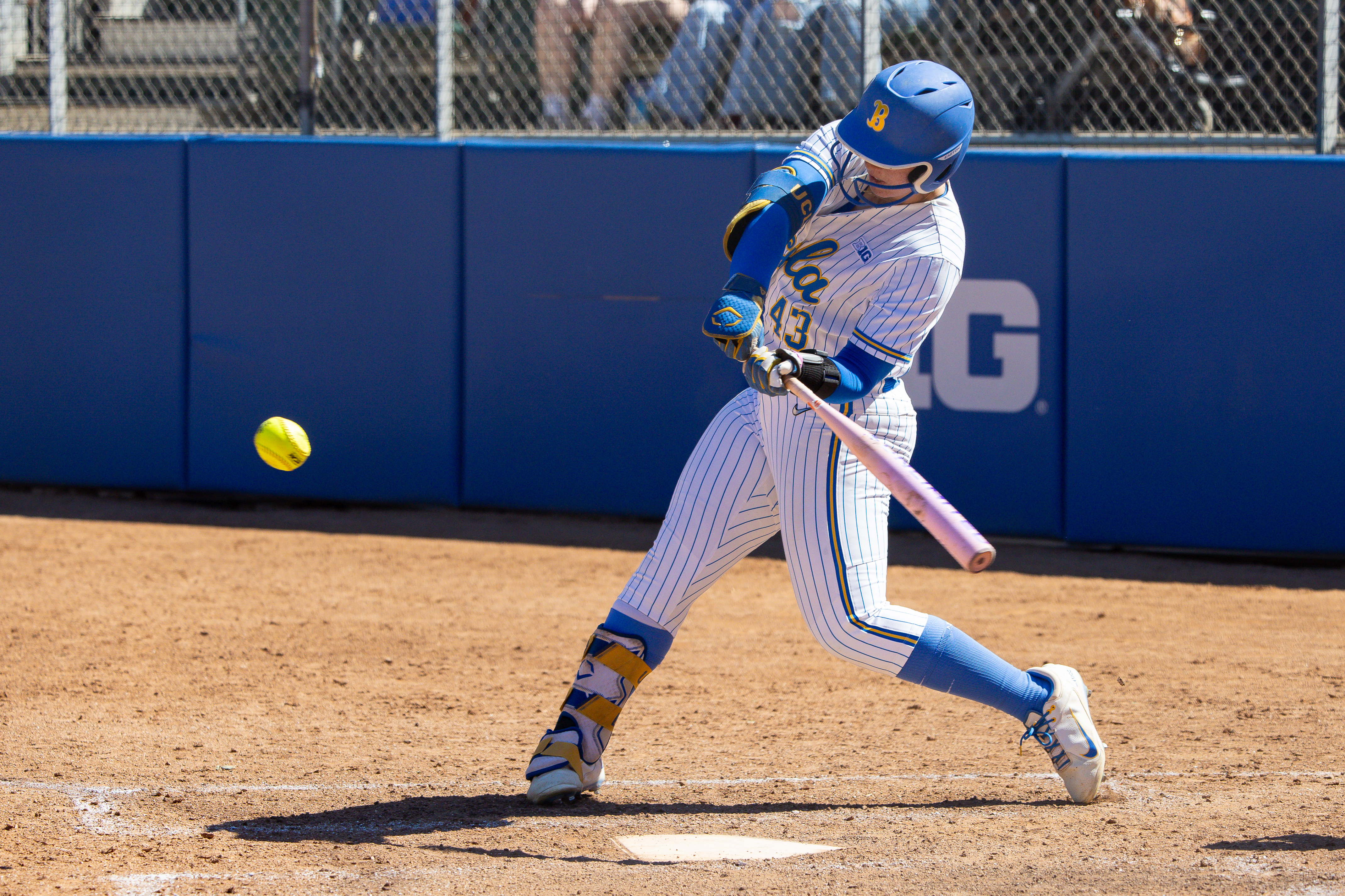 LOS ANGELES, CA - MARCH 08: UCLA Bruins Megan Grant (43) swings the bat in the second inning of a college softball game between the Wisconsin Badgers and the UCLA Bruins on March 8, 2026, at Easton Stadium in Los Angeles, California. (Photo by Greg Fiore/Icon Sportswire via Getty Images)
