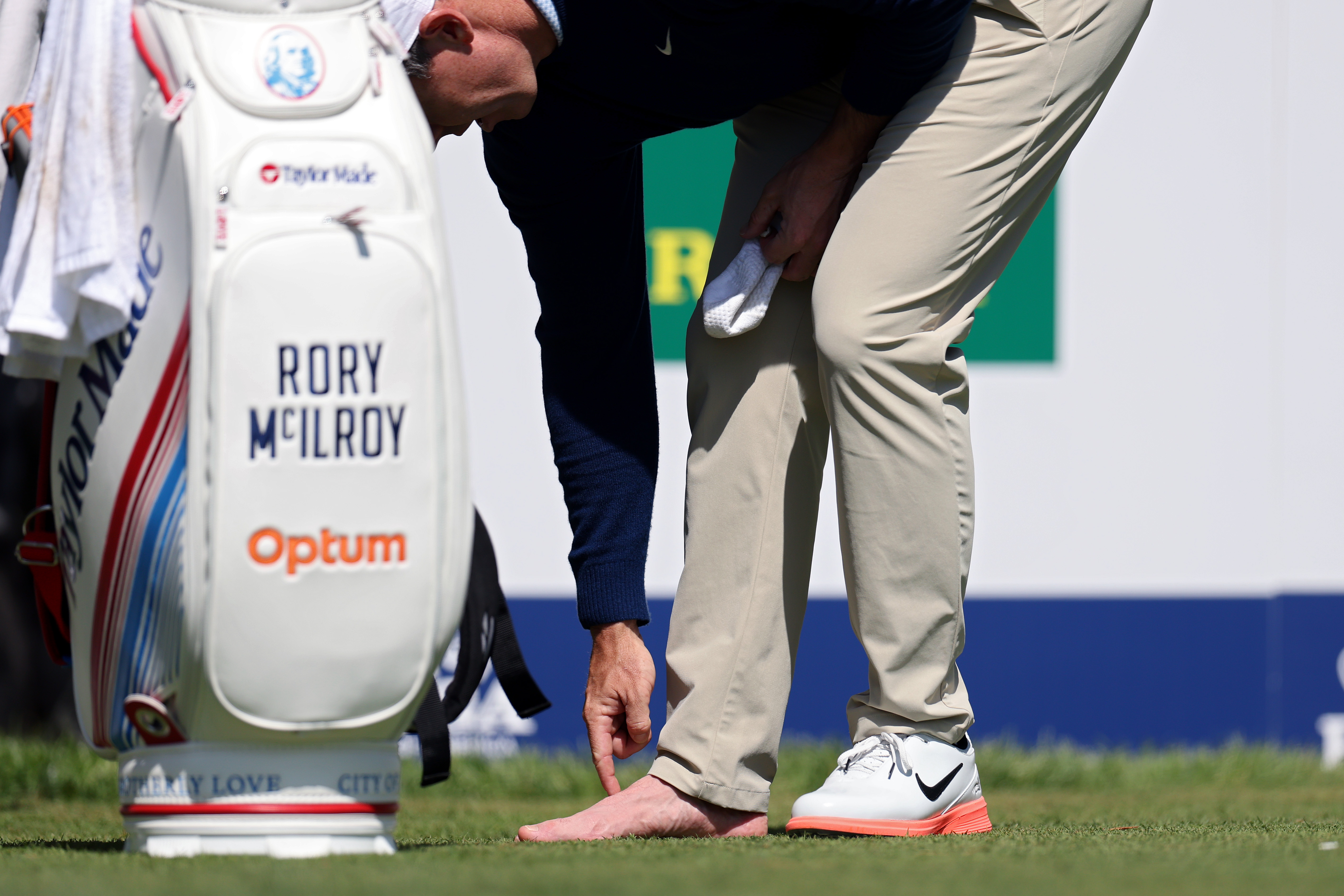 NEWTOWN, PENNSYLVANIA - MAY 12: Rory McIlroy of Northern Ireland looks at his foot on the fourth tee during a practice round prior to the PGA Championship at Aronimink Golf Club on May 12, 2026 in Newtown, Pennsylvania. (Photo by Emilee Chinn/Getty Images)