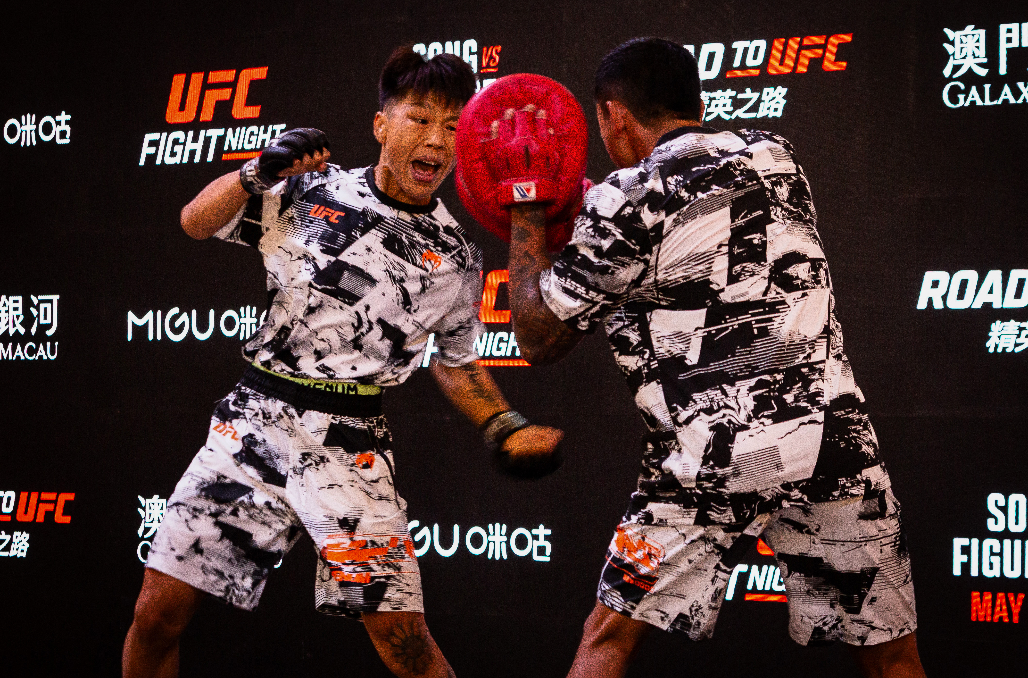 China's bantamweight boxer Xiong Jingnan (L) punches during a workout session at the opening ceremony of the UFC Fight Night at the Galaxy hotel resort in Macau on May 27, 2026. (Photo by Eduardo Leal / AFP via Getty Images)