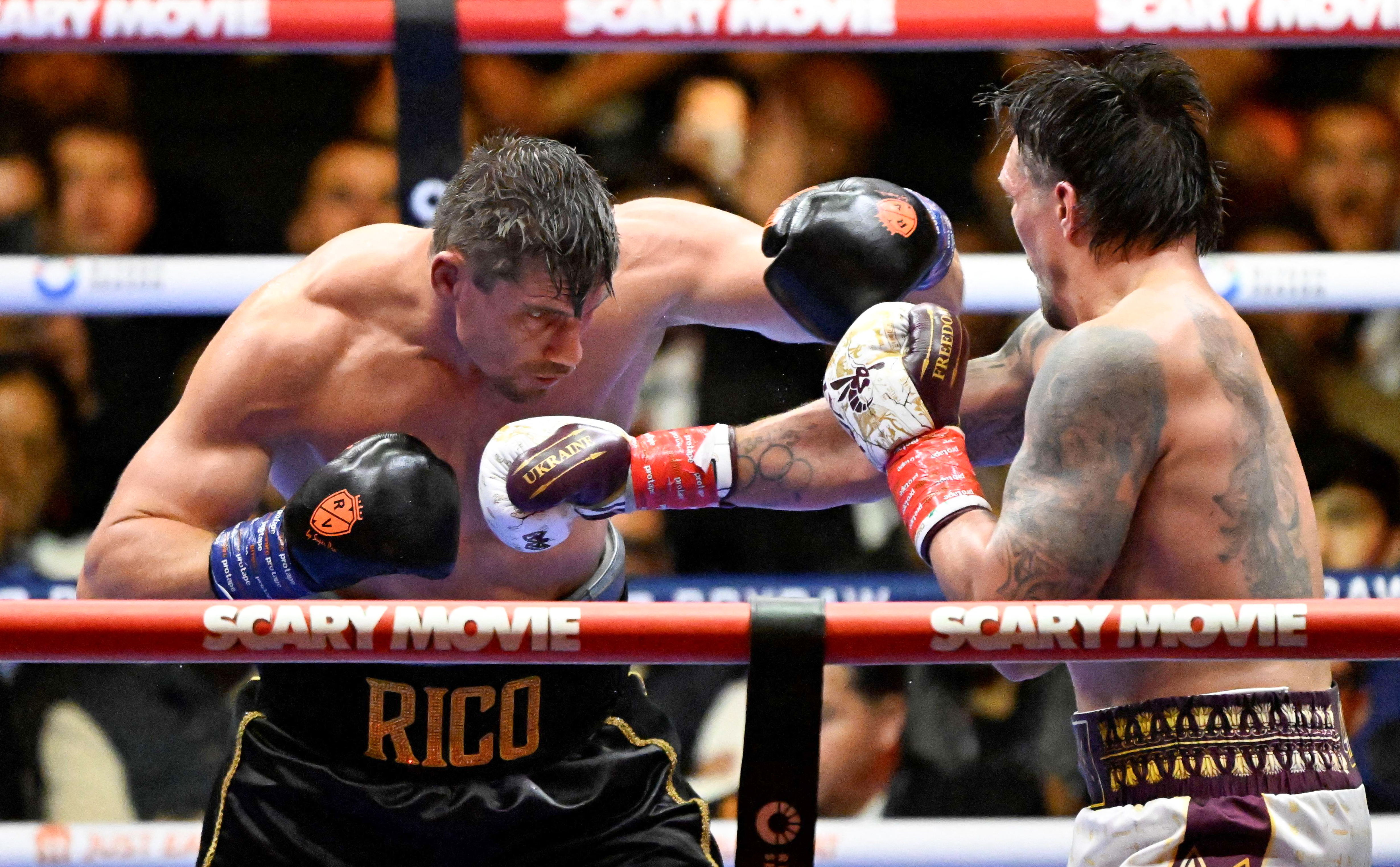 Ukraine's Oleksandr Usyk (R) fights Netherlands' Rico Verhoeven (L) during their WBC World Heavyweight Championship 'Glory in Giza' boxing match at the Pyramids of Giza on May 23, 2026. Heavyweight boxing king Oleksandr Usyk retained his titles after a dramatic and controversial stoppage victory over kick-boxer Rico Verhoeven with a second left of the 11th round in Egypt on May 23. (Photo by Khaled DESOUKI / AFP via Getty Images)