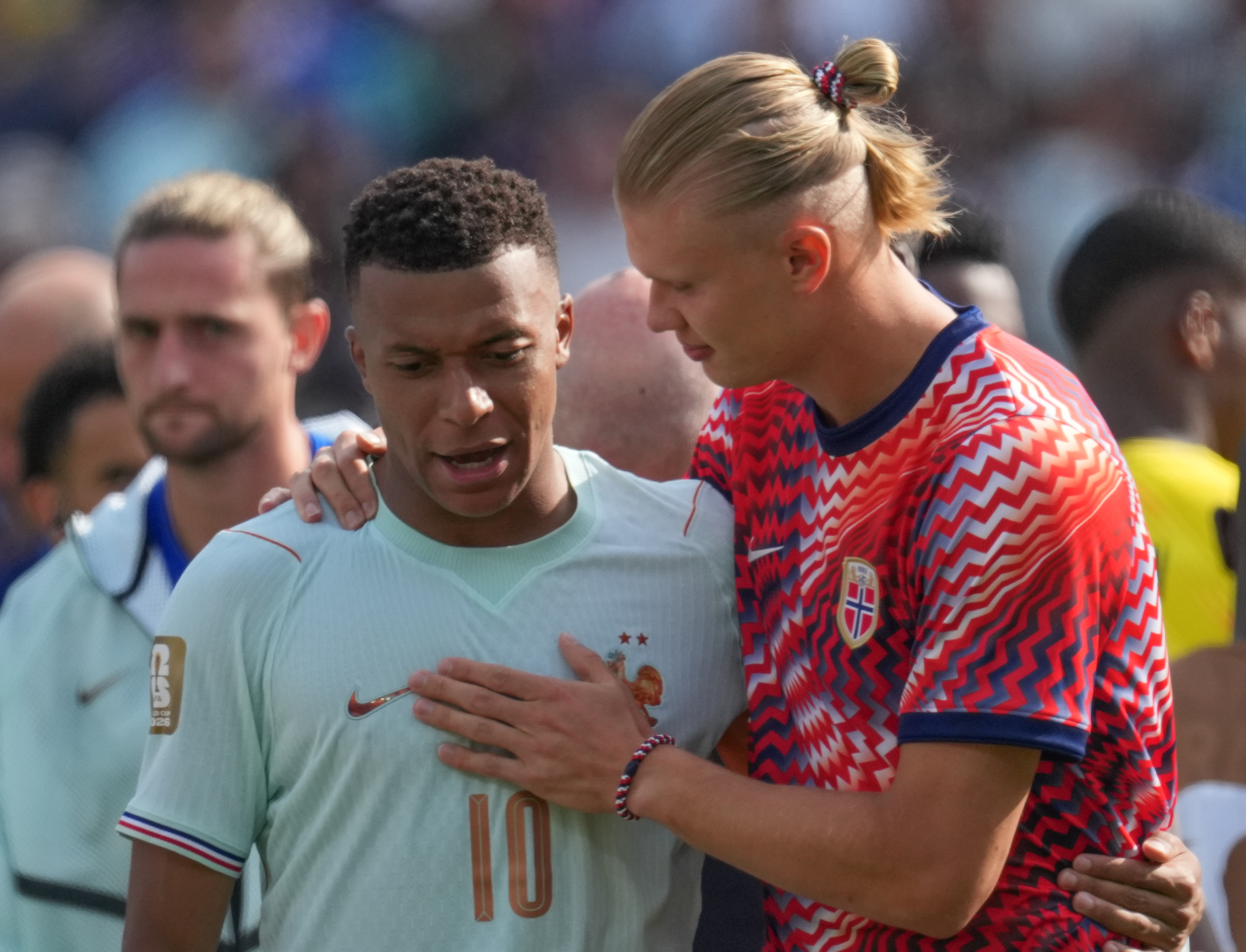France's Kylian Mbappe (10) left and Norway's Erling Haaland (9) in conversation after final whistle during the World Cup Group I soccer match between Norway and France in Foxborough, Mass., near Boston,Friday,June,26 2026. (AP Photo/Dave Shopland)