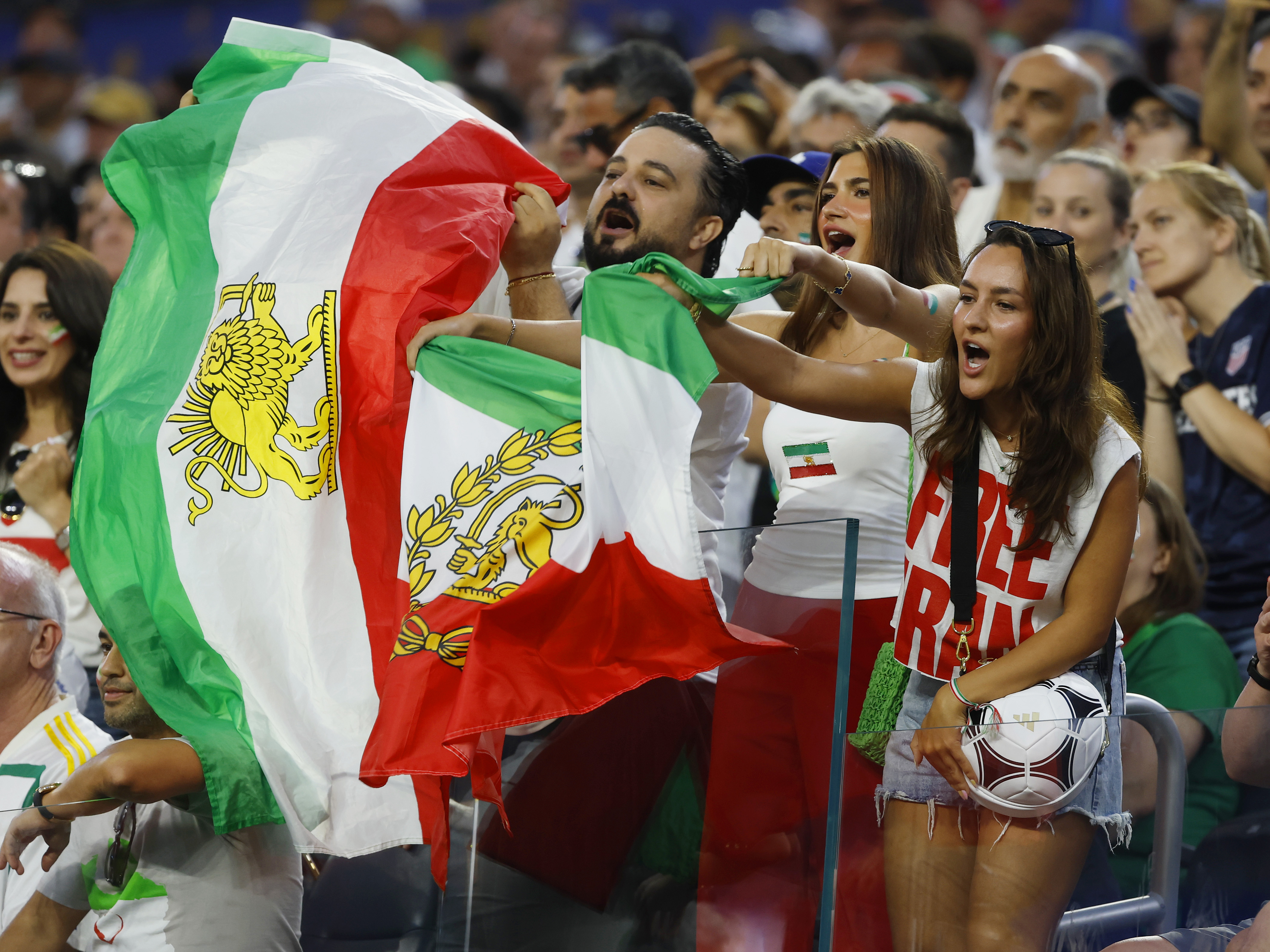 At Iran’s World Cup opener, a banned flag became a flashpoint at the stadium gates