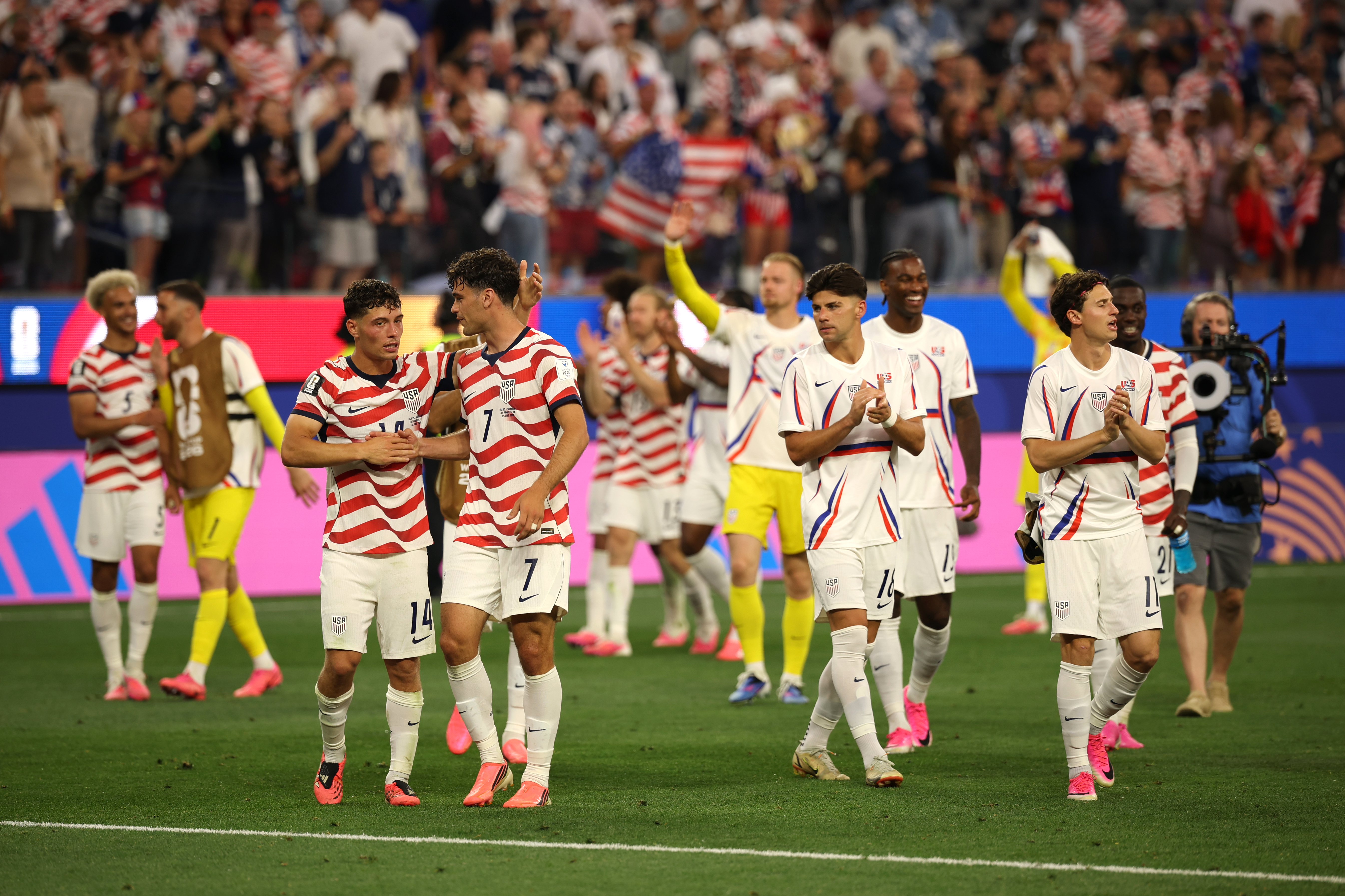 LOS ANGELES, CALIFORNIA - JUNE 12: Sebastian Berhalter #14 and Giovanni Reyna #7 of the United States celebrate after the team's victory in the FIFA World Cup 2026 Group D match between USA and Paraguay at Los Angeles Stadium on June 12, 2026 in Los Angeles, California. (Photo by Jared C. Tilton - FIFA/FIFA via Getty Images)