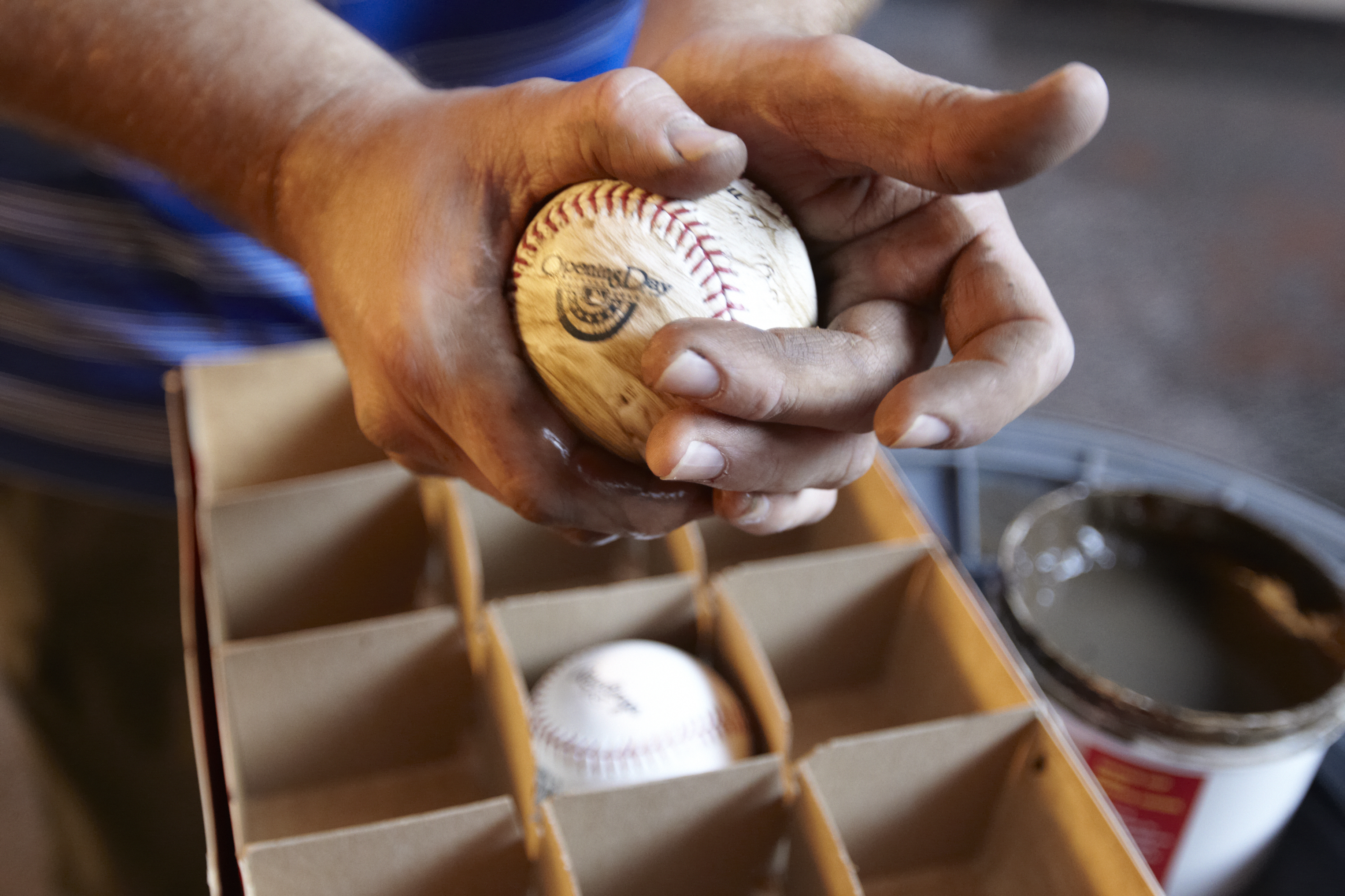 Baseball: Closeup view of New York Mets clubhouse assistant rubbing baseballs with mud before Opening Day game vs San Diego Padres. 
Flushing, NY 4/1/2013
CREDIT: Chuck Solomon (Photo by Chuck Solomon /Sports Illustrated via Getty Images)
(Set Number: X156337 TK1 R1 F57 )